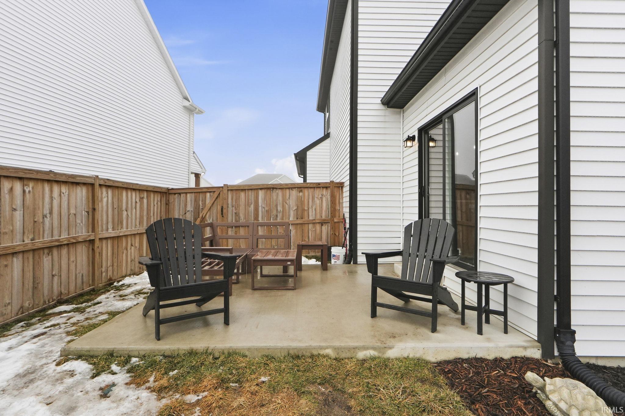 Fenced backyard with a patio area