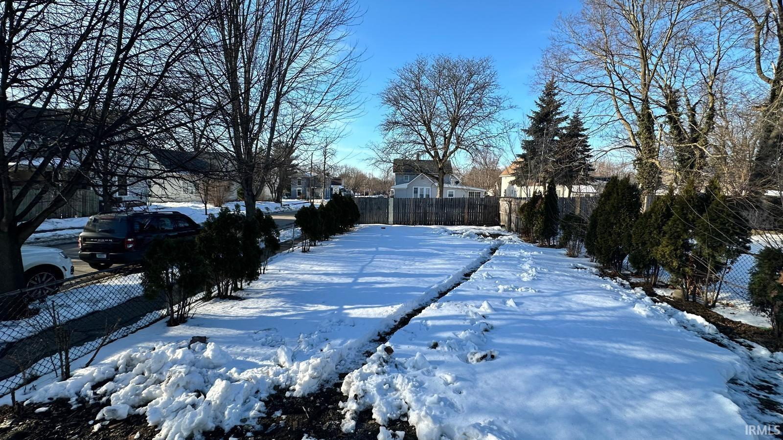View of yard layered in snow