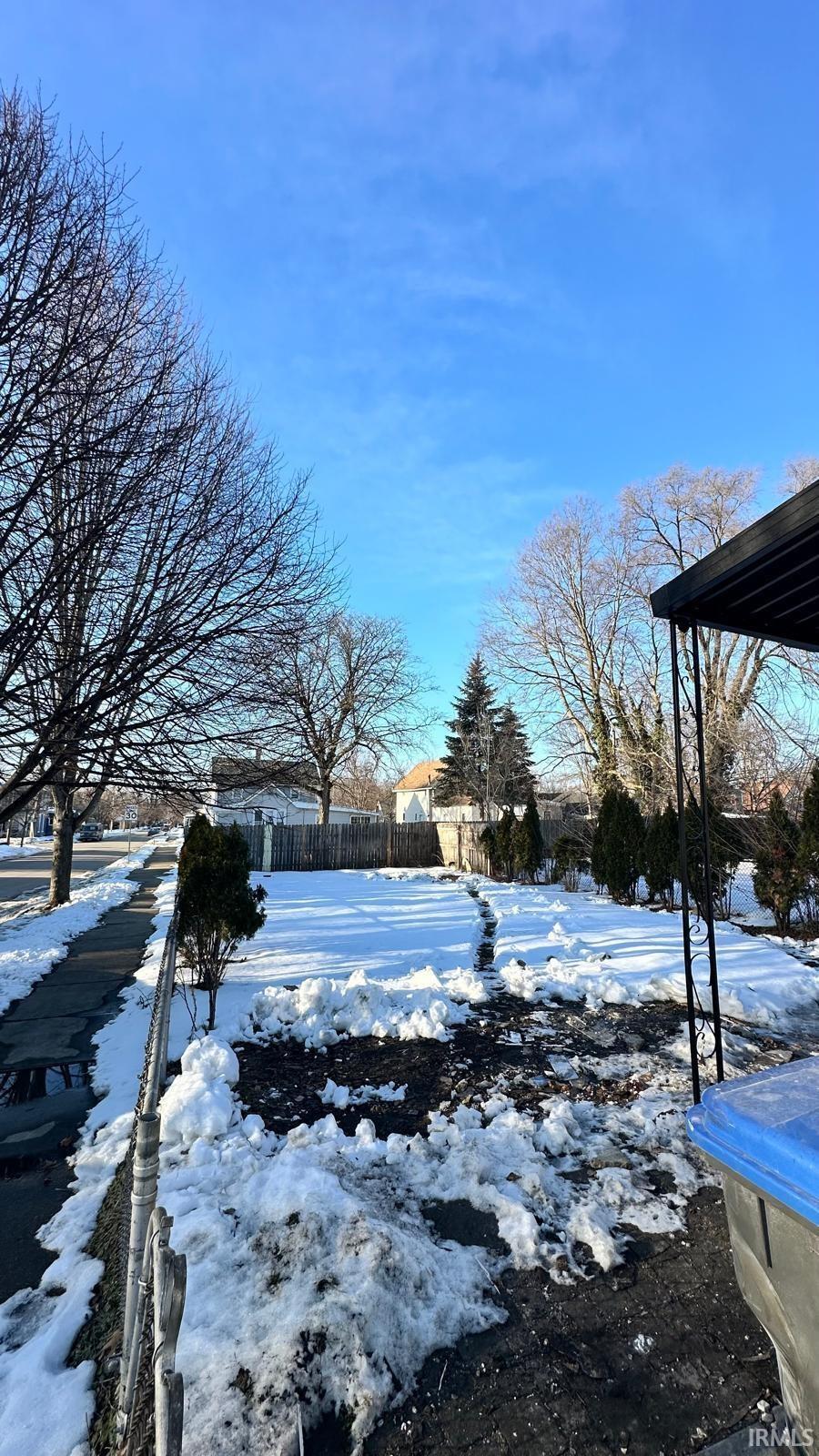View of yard layered in snow