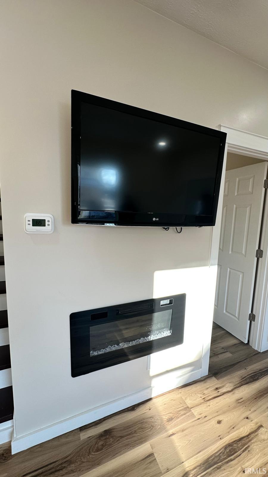 Detailed view of wood finished floors and baseboards