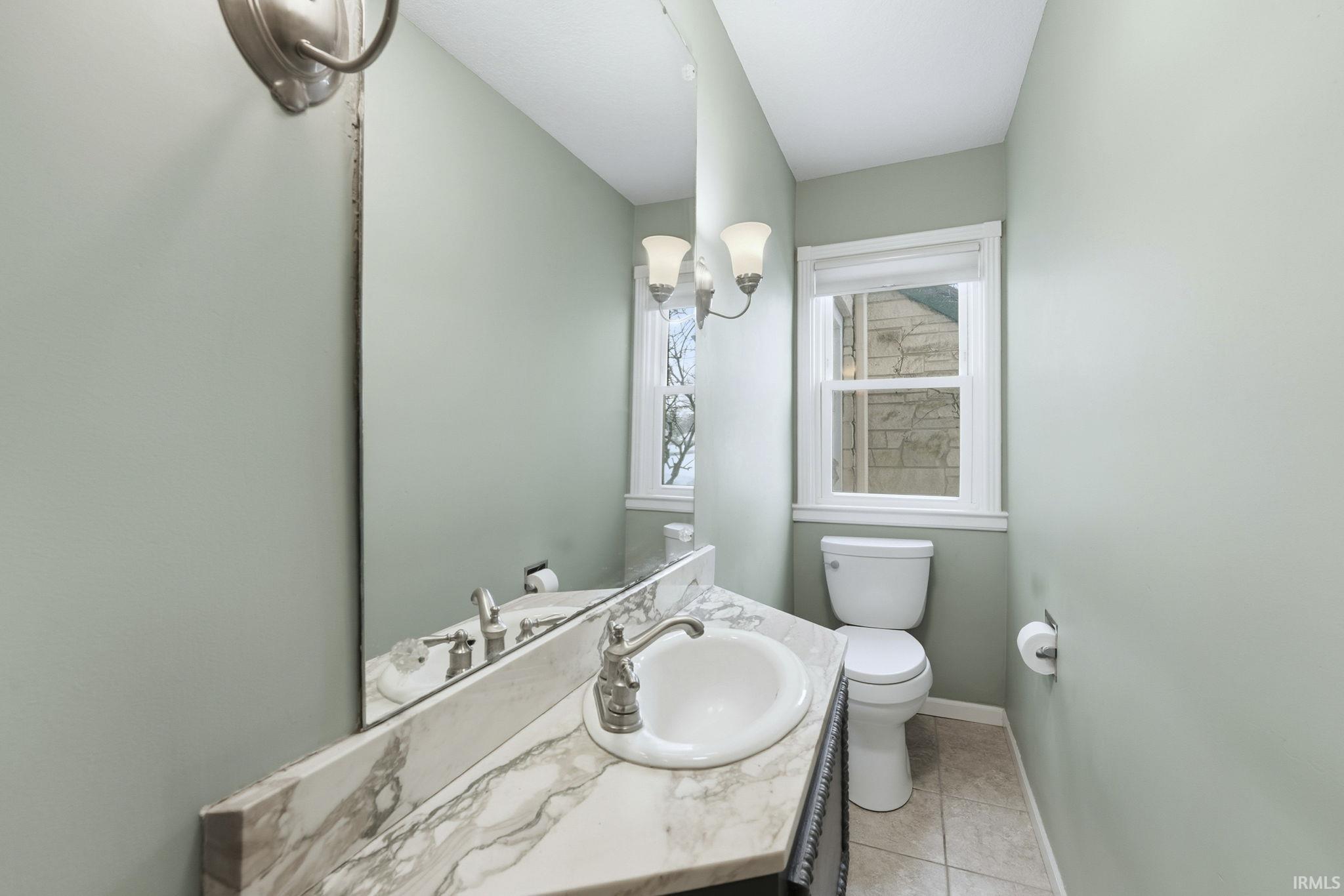 Bathroom featuring vanity and light tile patterned flooring
