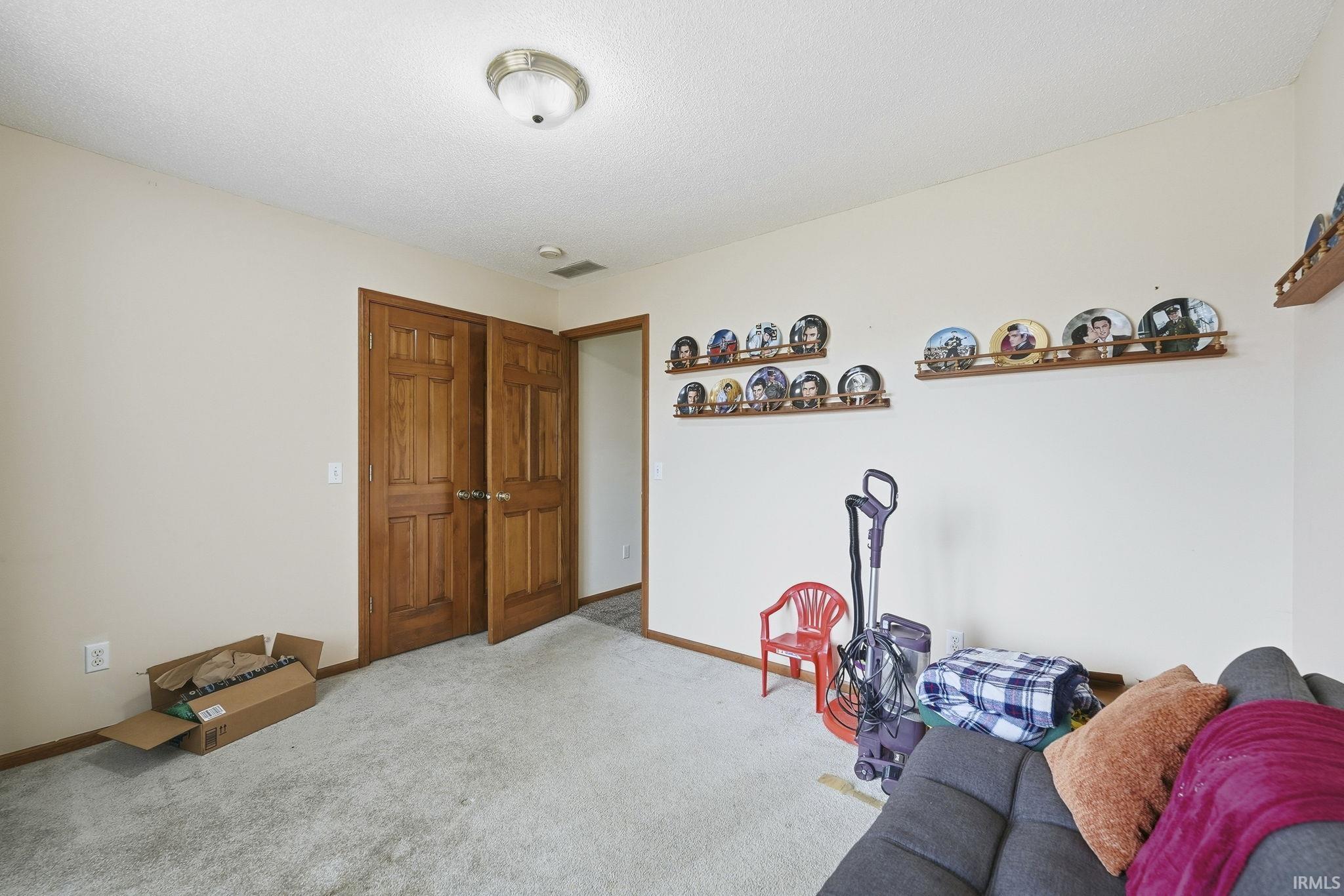 Playroom featuring carpet floors and baseboards