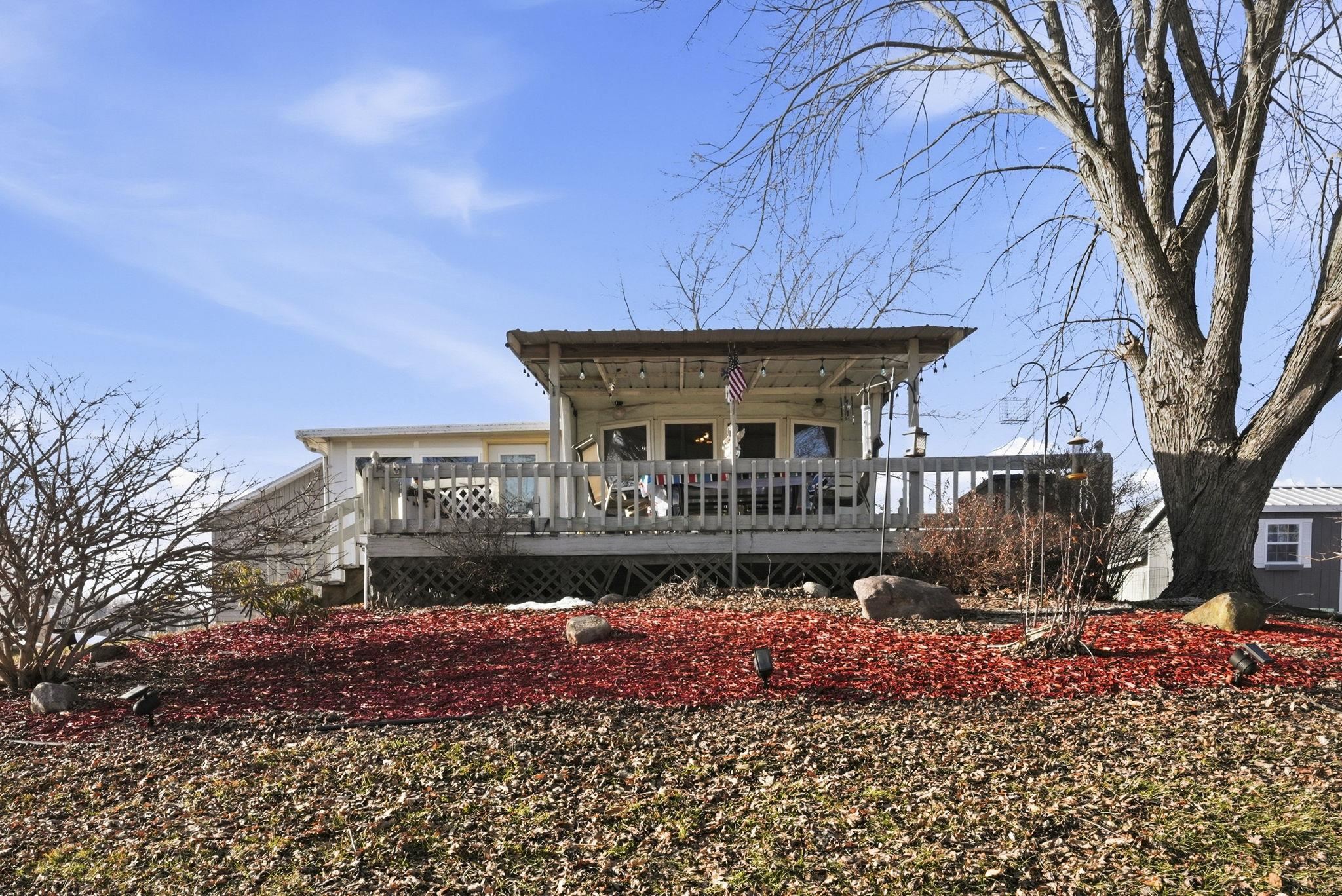 Back of property featuring a wooden deck