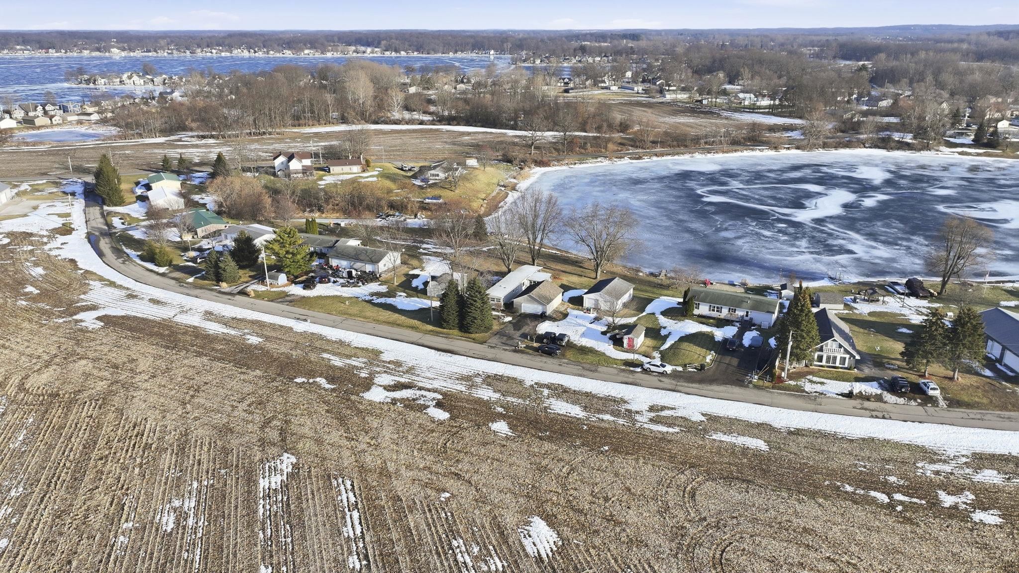 Snowy aerial view with a residential view