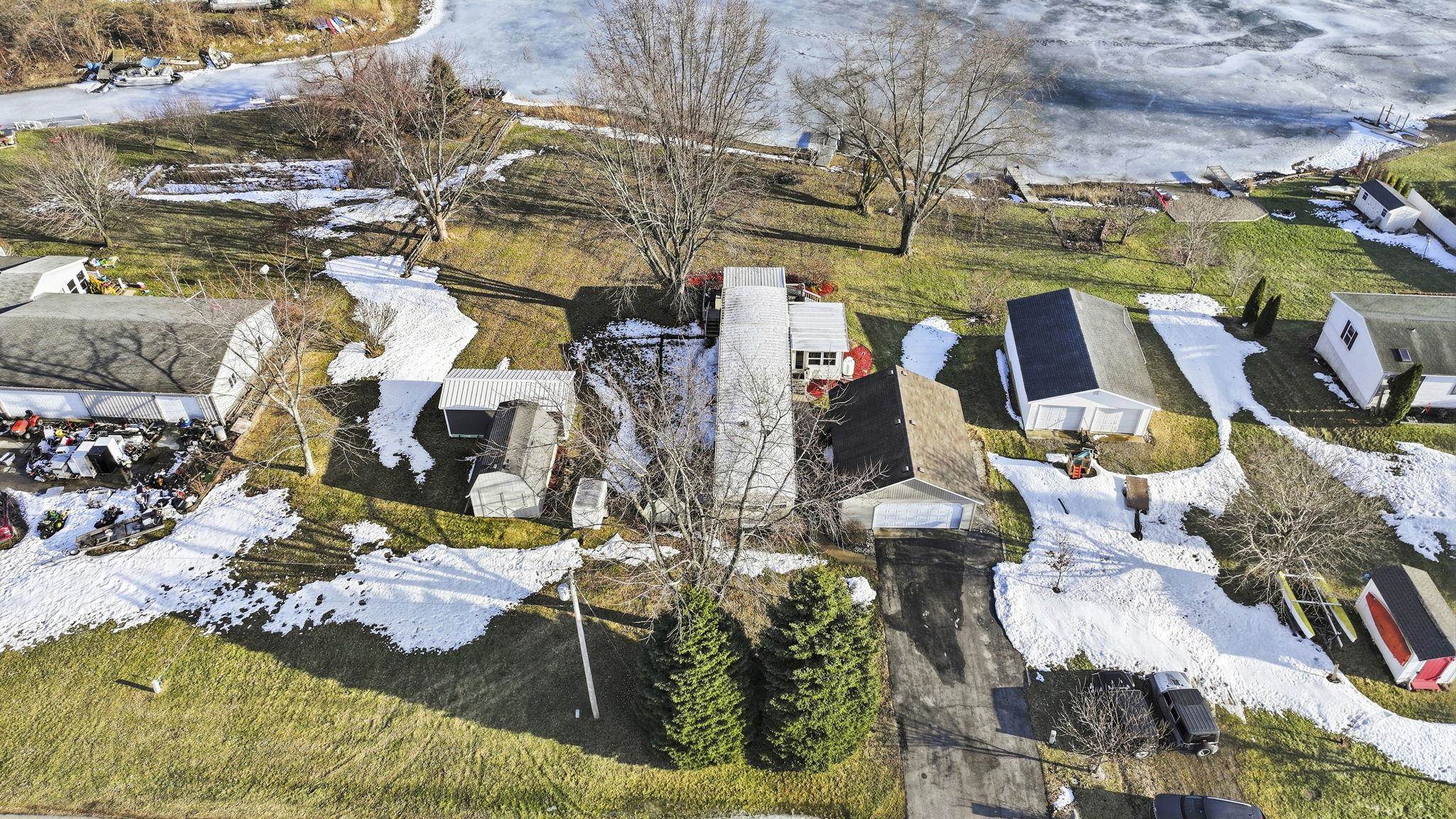 Snowy aerial view featuring a residential view