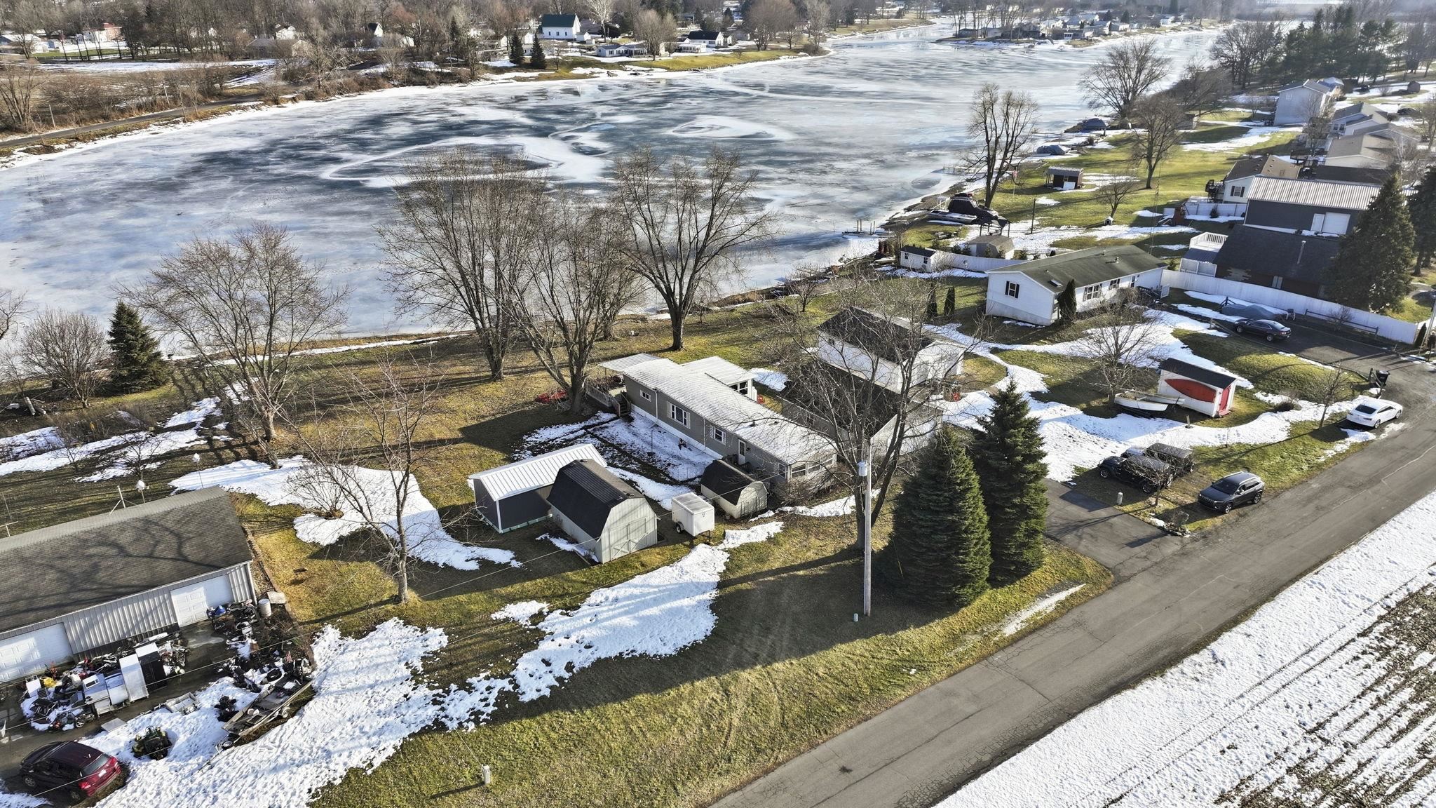 Snowy aerial view featuring a residential view
