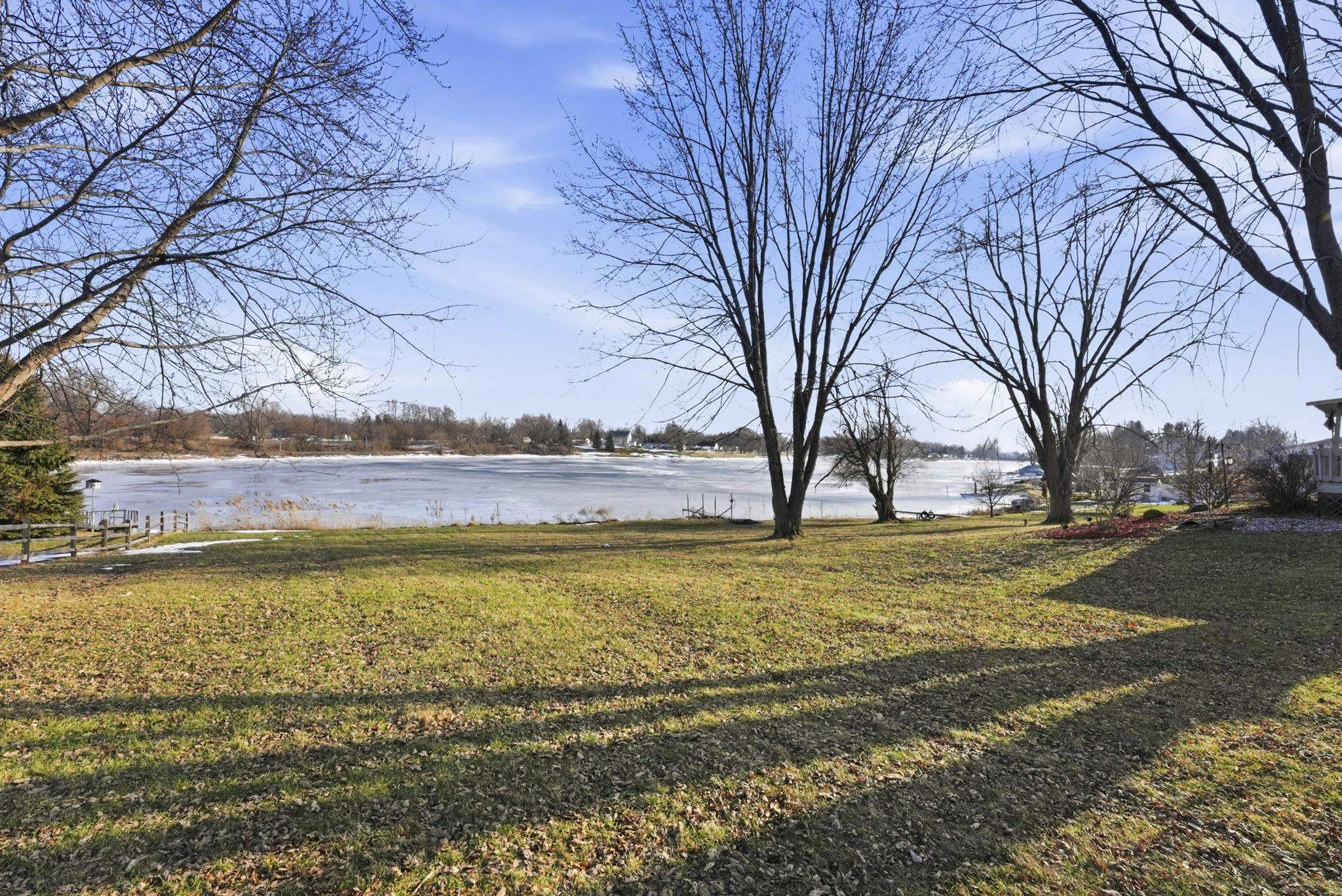 View of green lawn with a water view