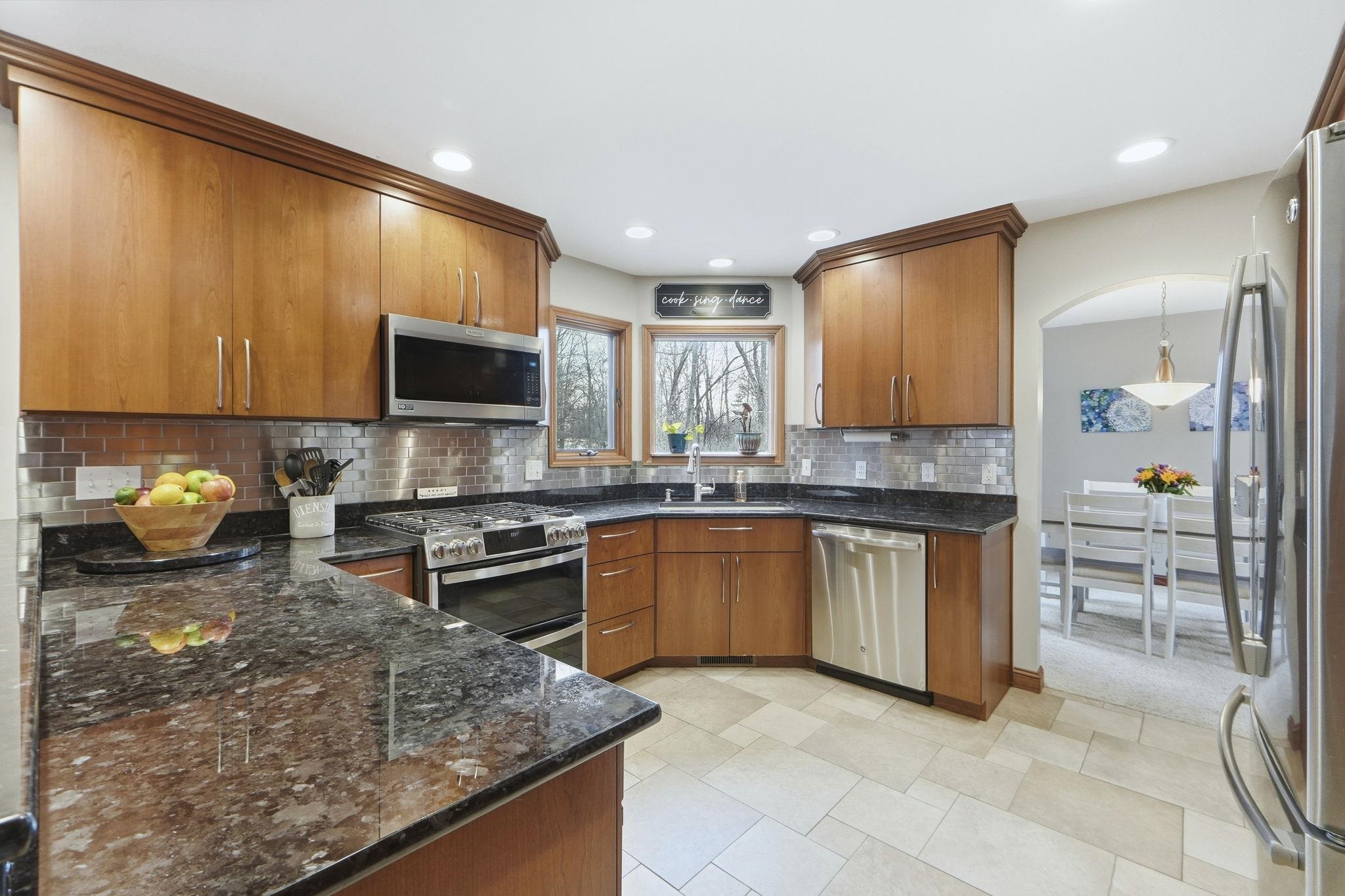 Large kitchen with granite counter tops and pull out drawers in pantry to allow maximum space!