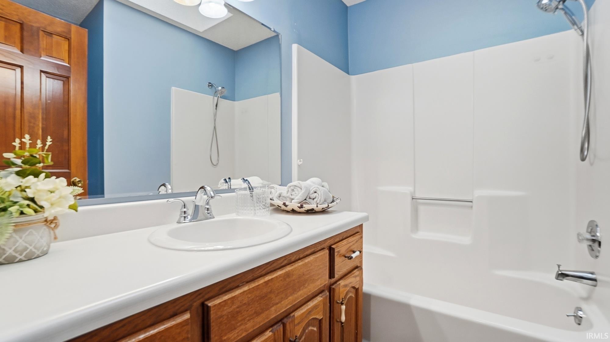 Full bath with vanity and  shower combination