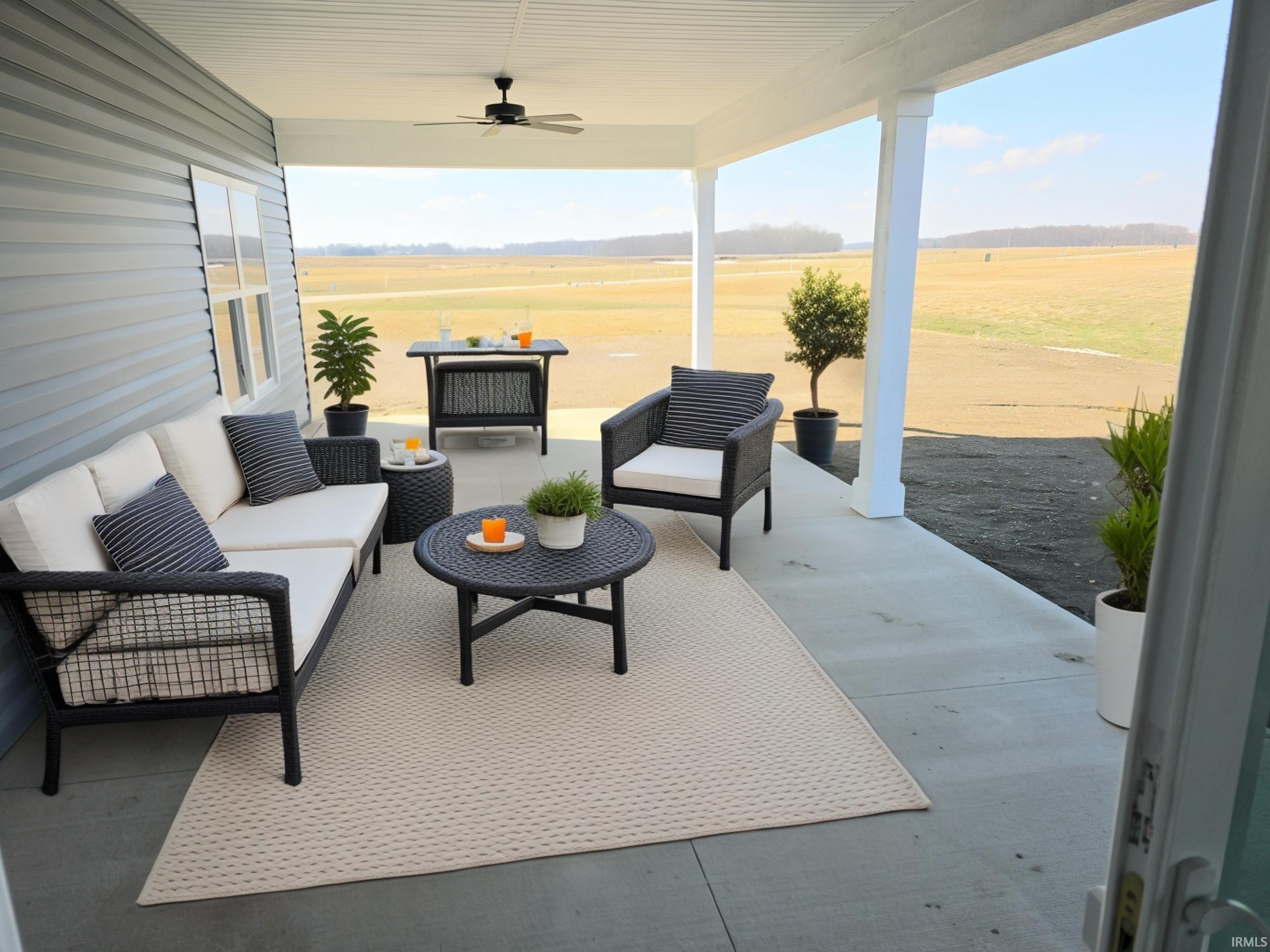 View of patio featuring ceiling fan and an outdoor lounge area