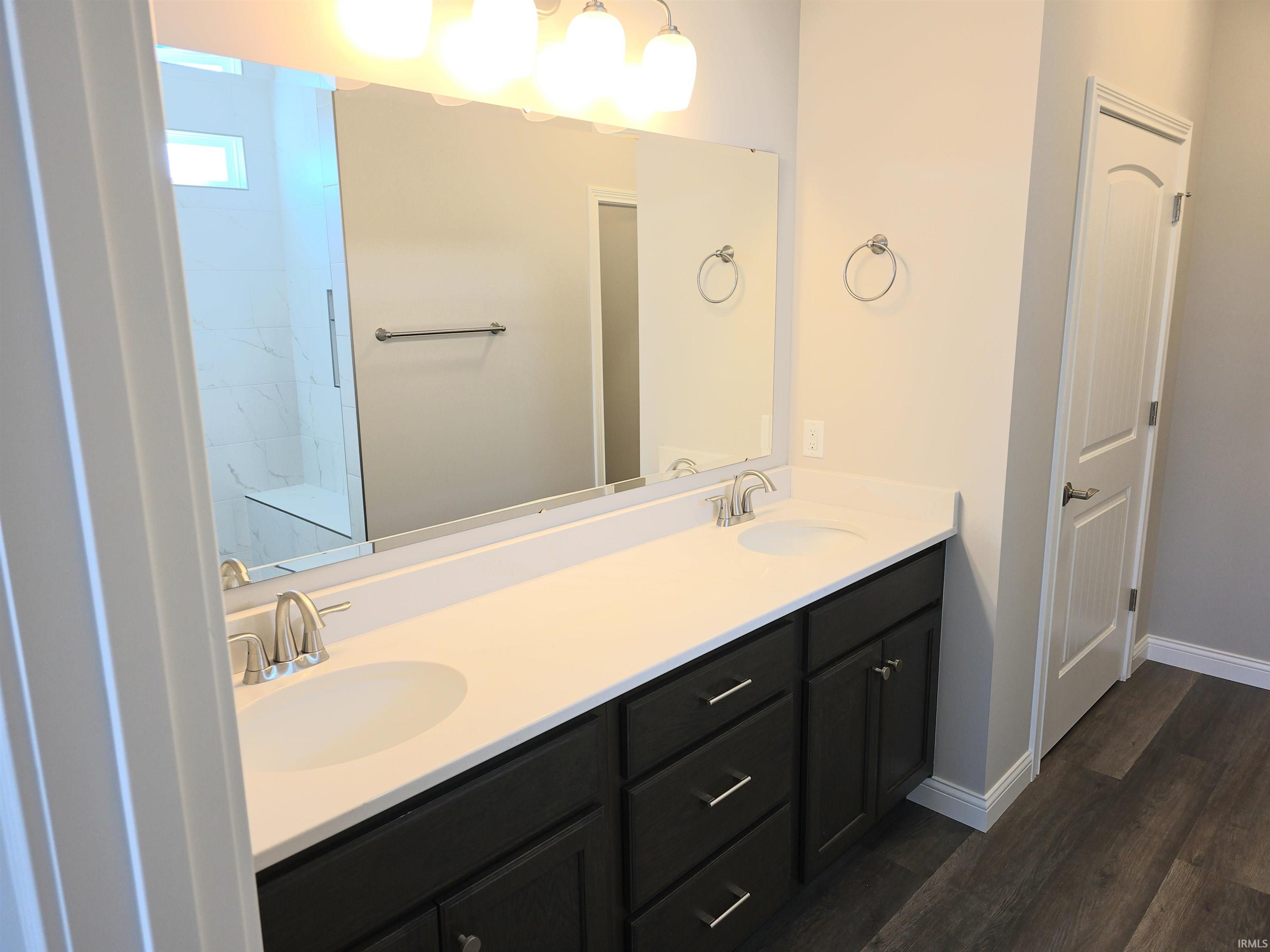 Full bathroom featuring double vanity