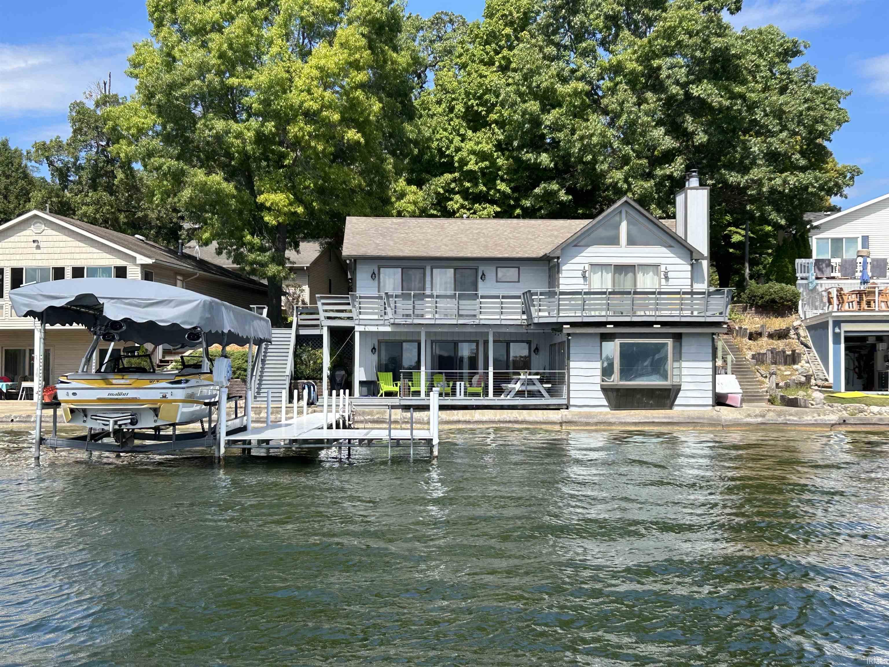 Dock area featuring stairs and a water view