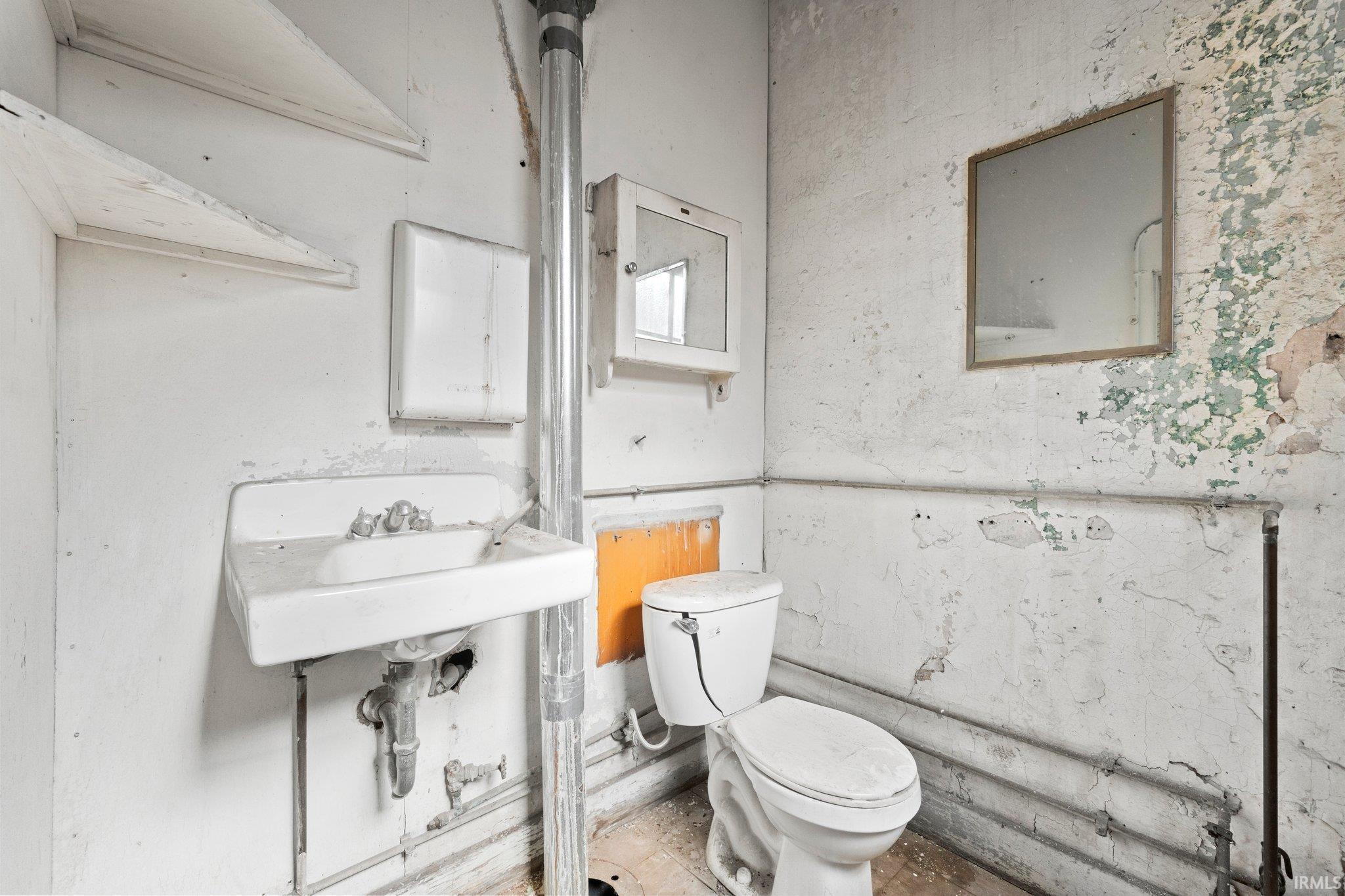 Bathroom featuring toilet and a sink