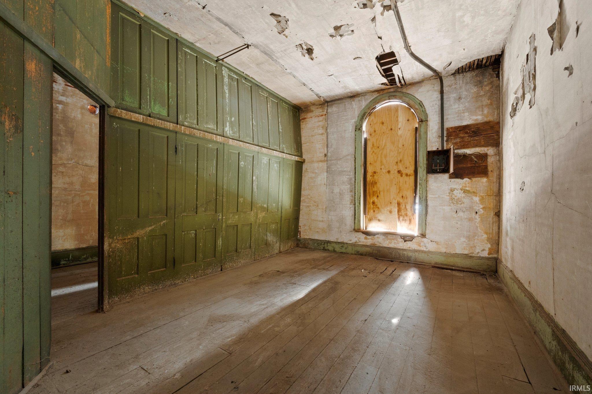 Empty room featuring hardwood / wood-style flooring