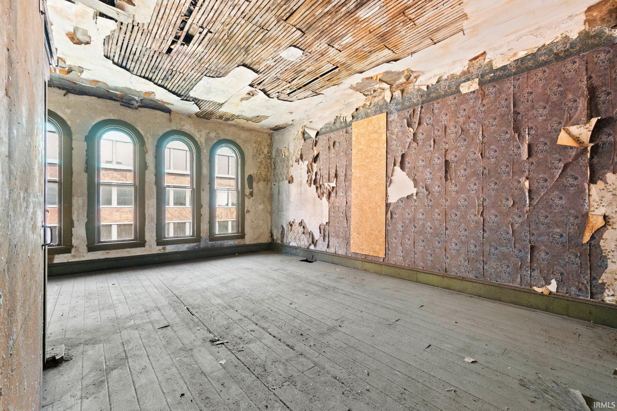 Unfurnished room with hardwood / wood-style flooring