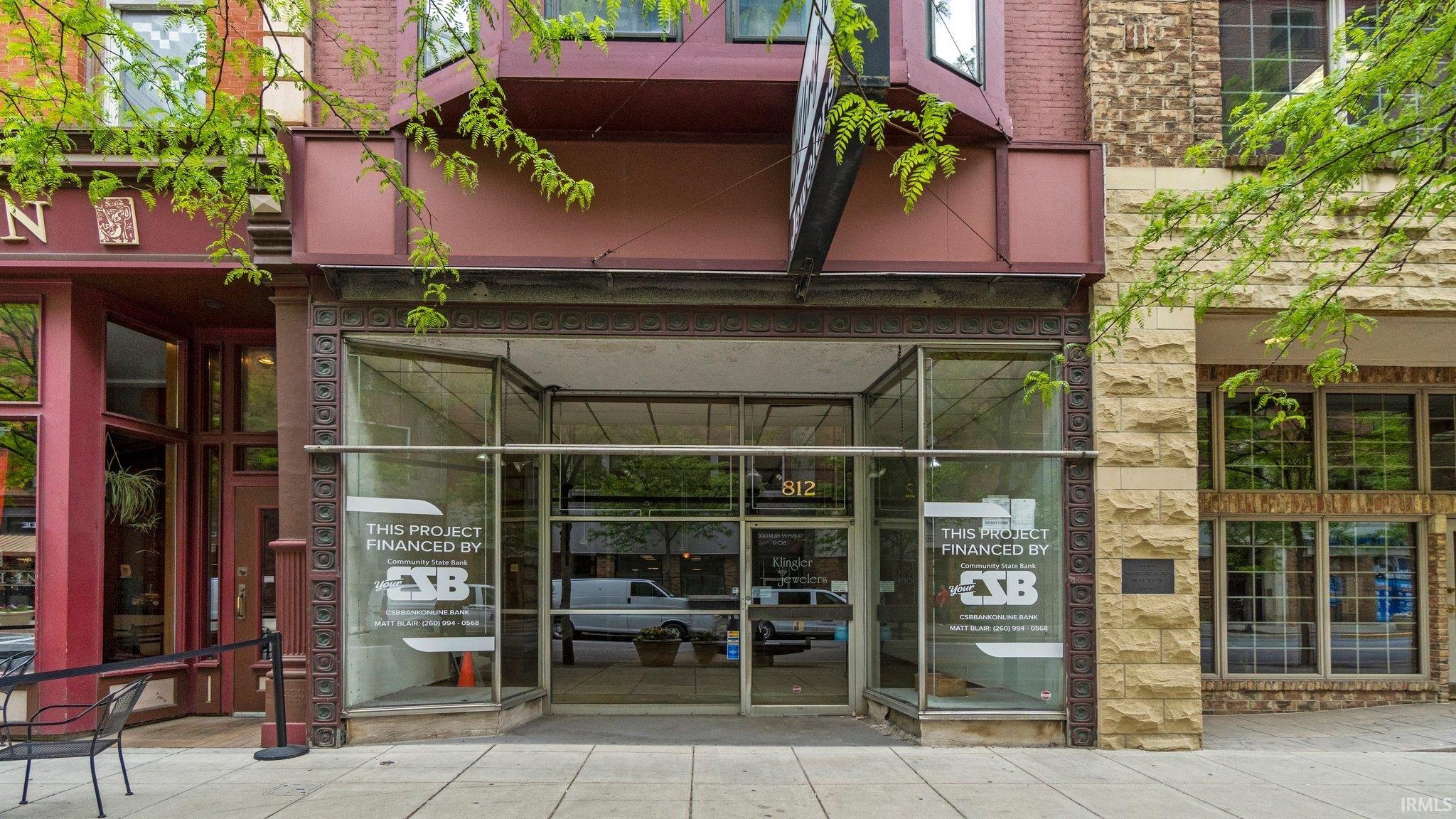 Property entrance featuring stone siding