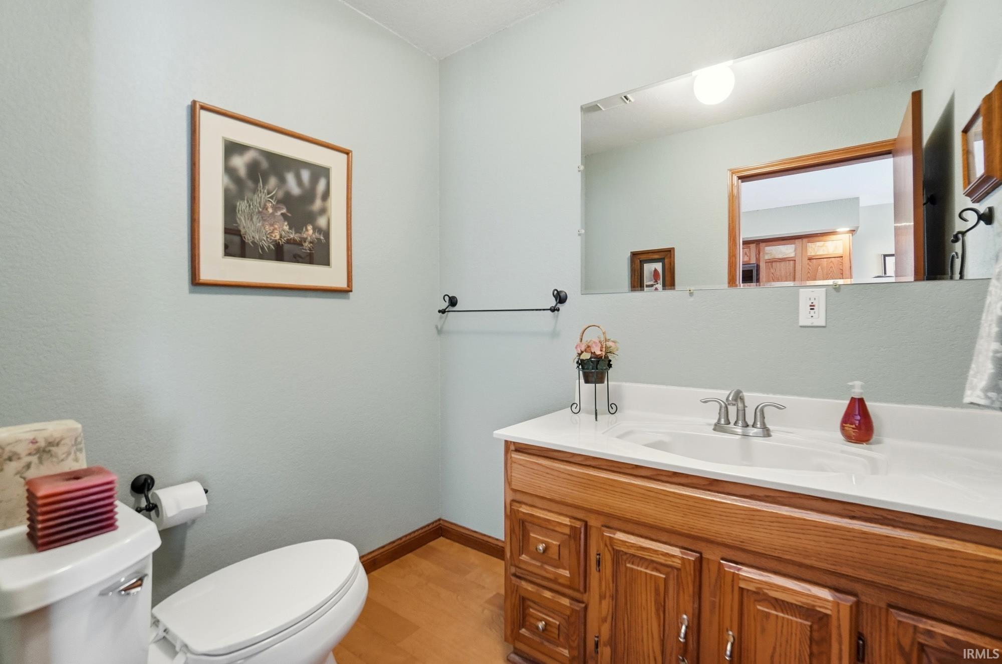 Bathroom featuring vanity and light wood-style flooring