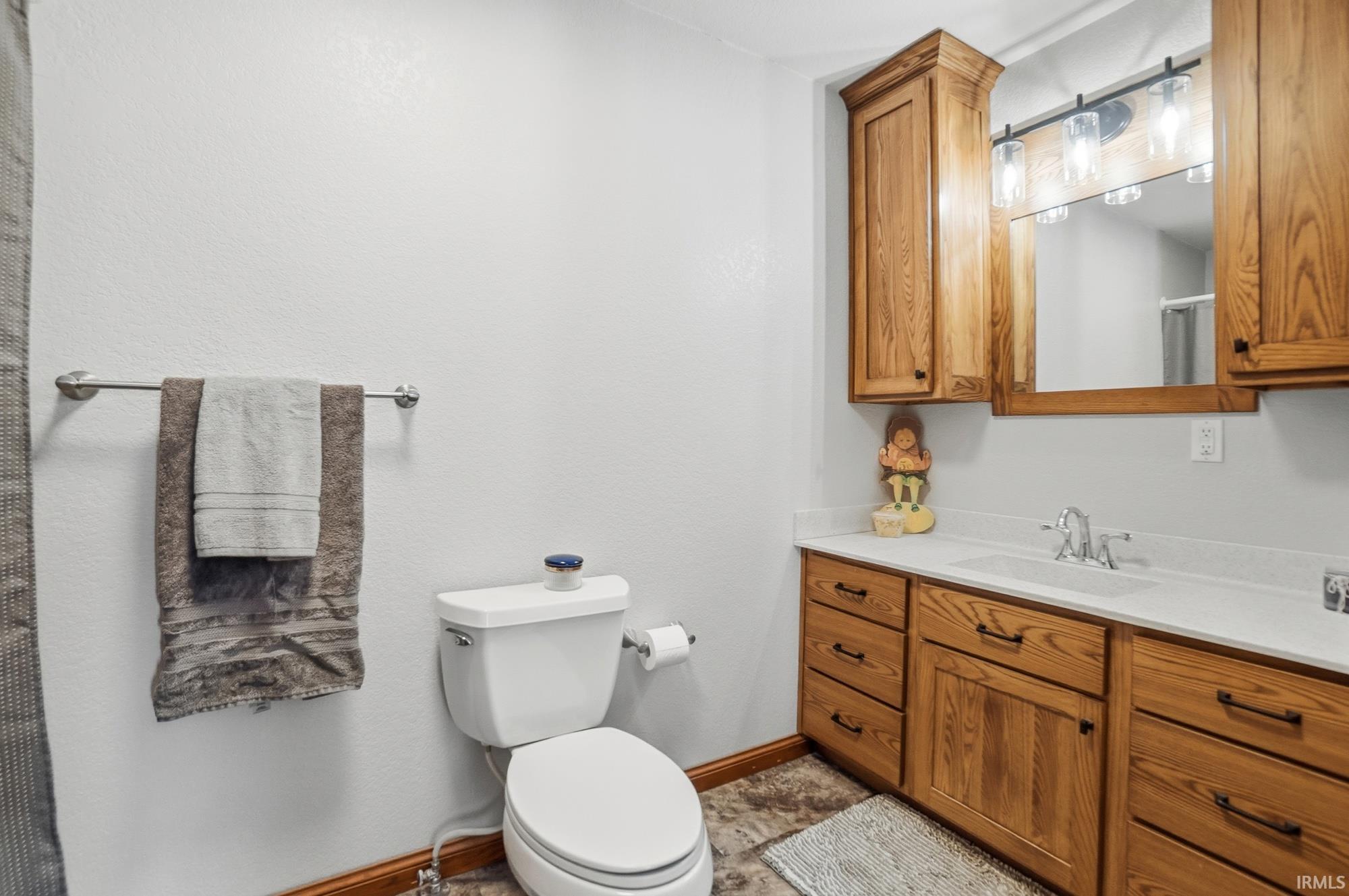 Full bathroom featuring vanity and a shower