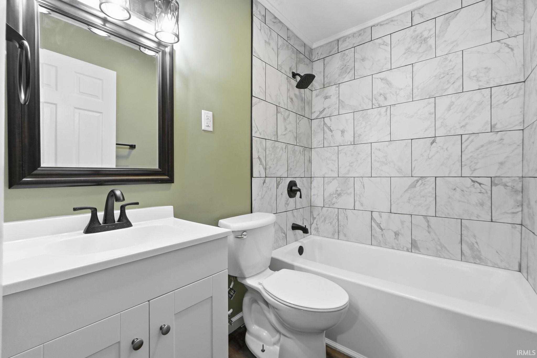 Full bathroom with vanity and shower / tub combination