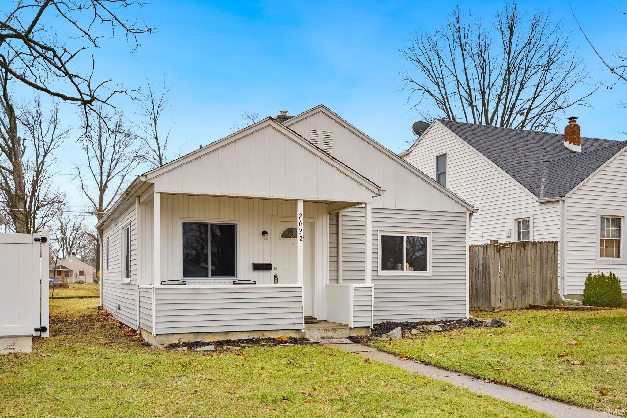 Bungalow featuring a porch and board and batten siding