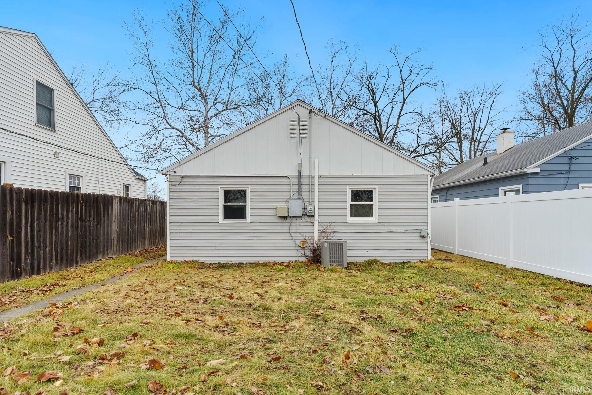 Back of house featuring a fenced backyard