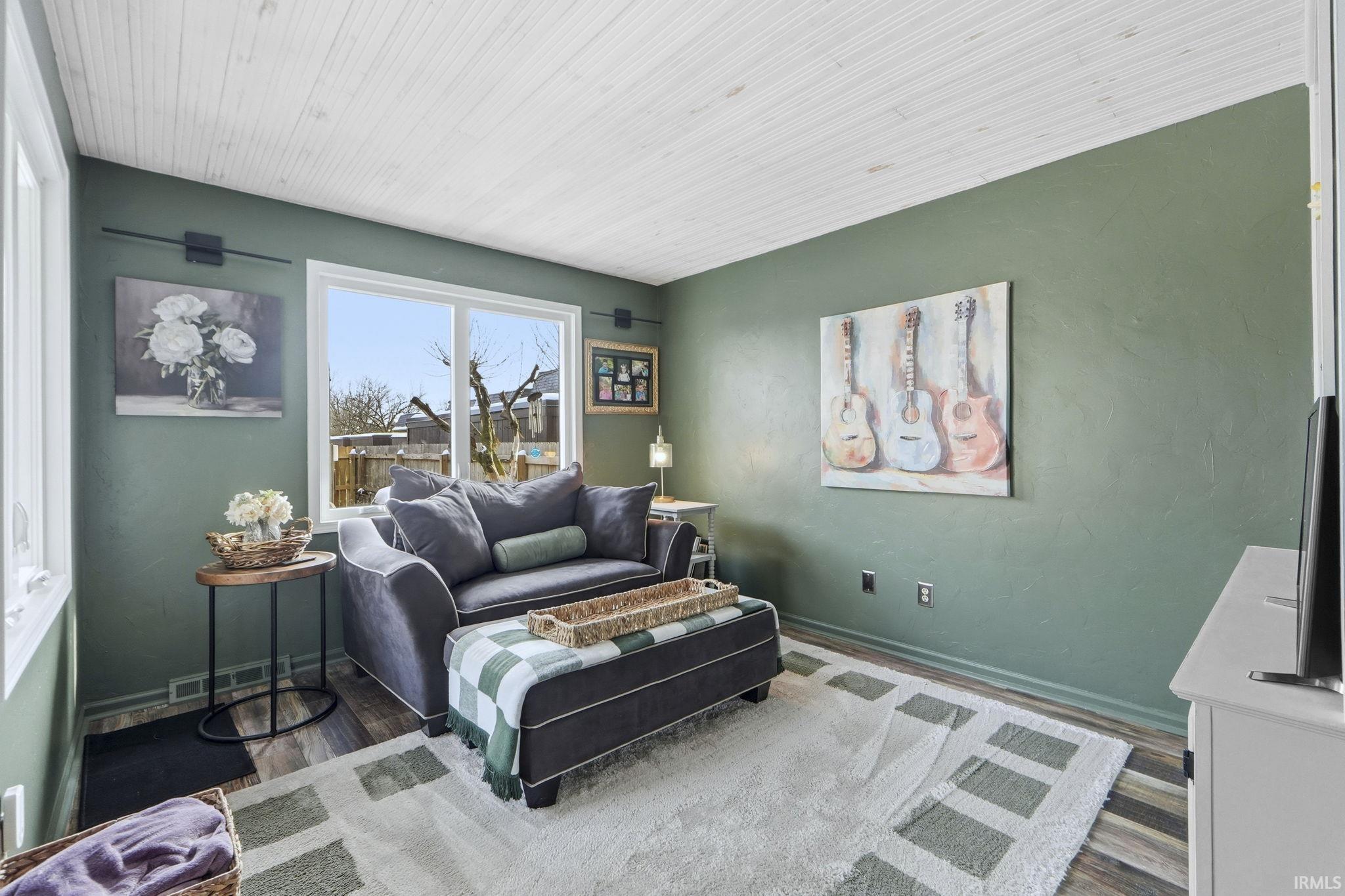 Living area featuring wood finished floors and baseboards