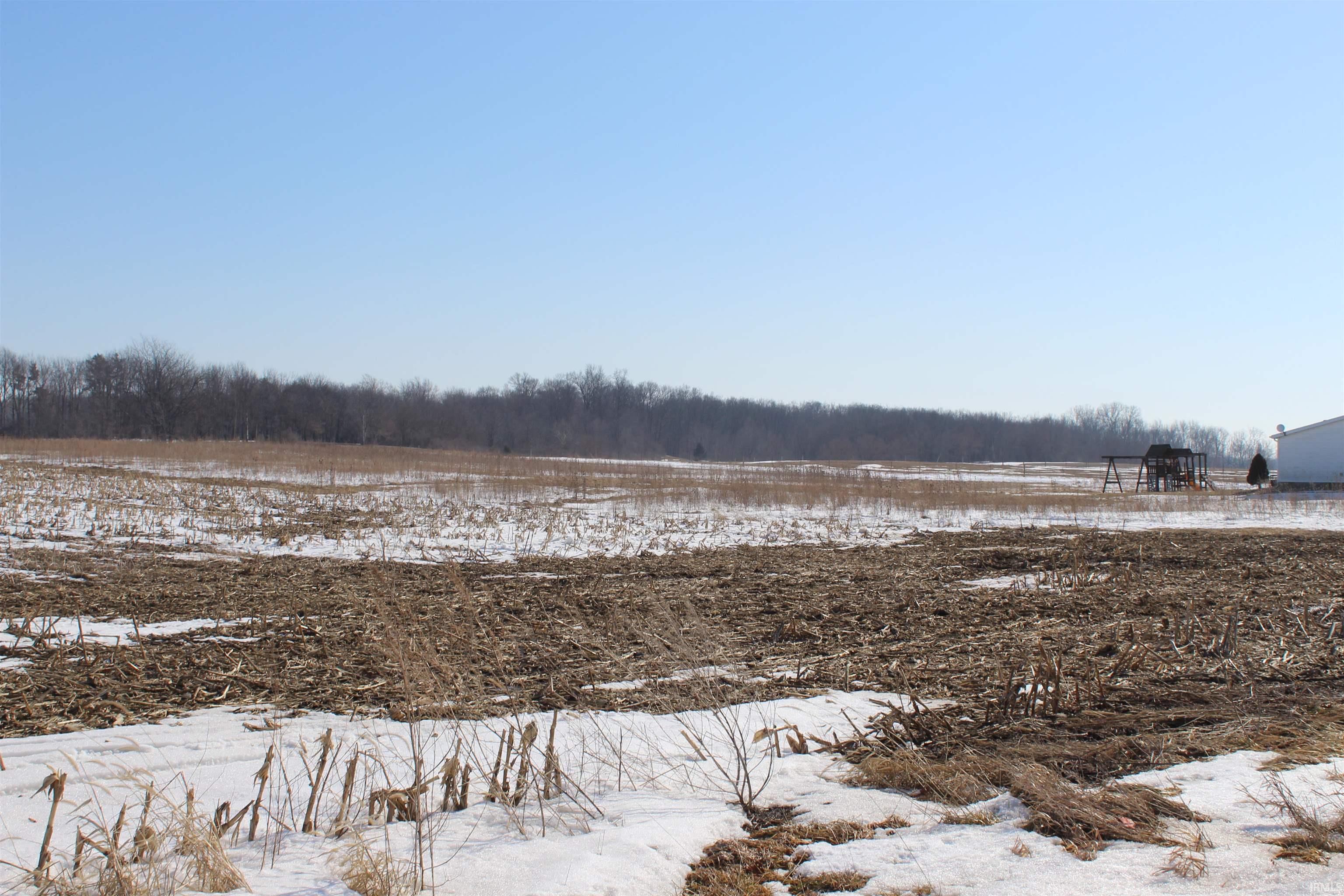 View of yard covered in snow