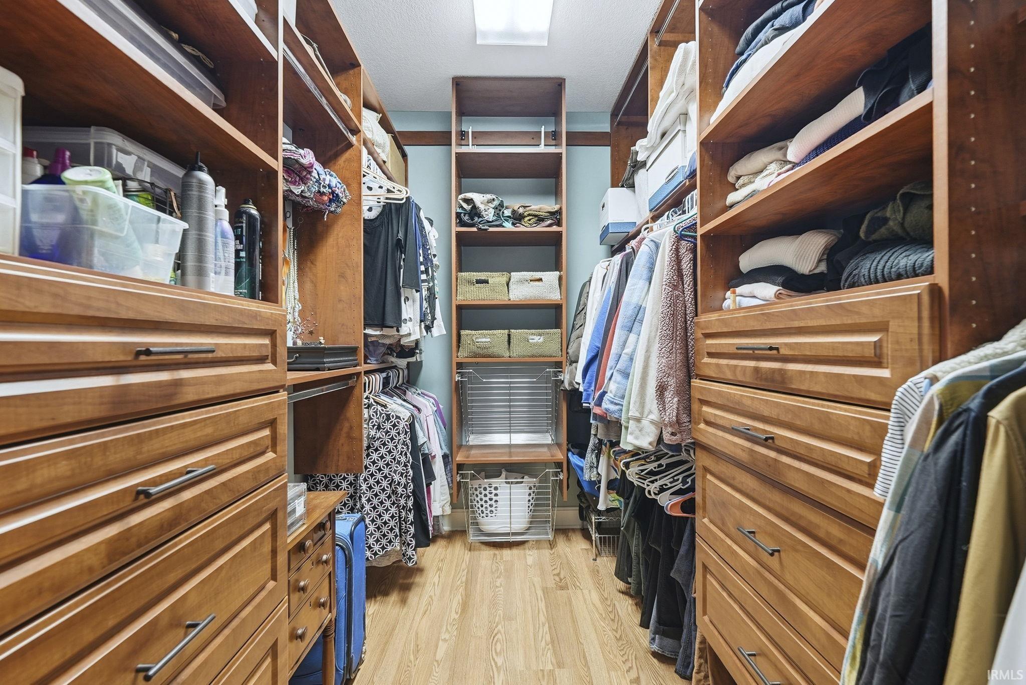 Walk in closet featuring light wood-type flooring