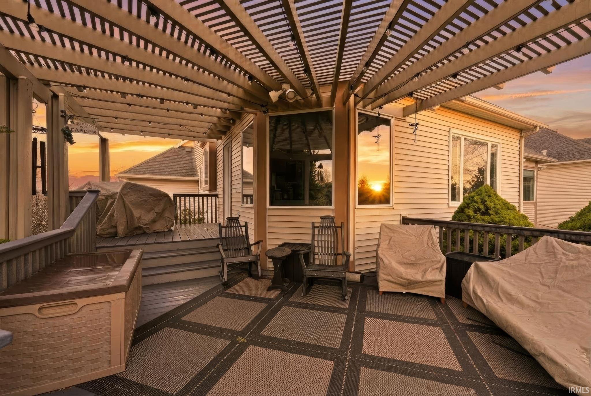 View of patio with a pergola and an outdoor lounge area