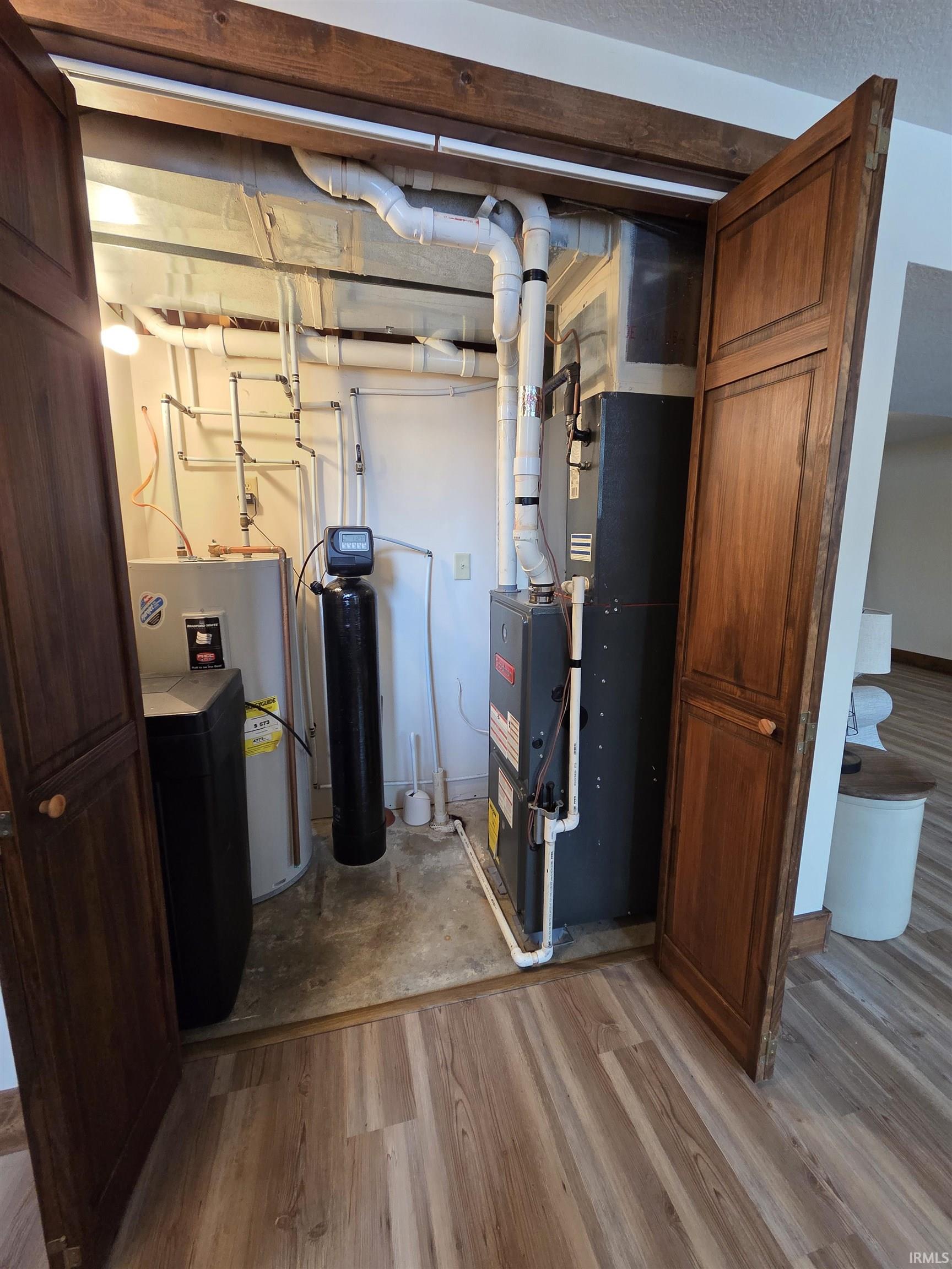 Utilities featuring heating unit and electric water heater