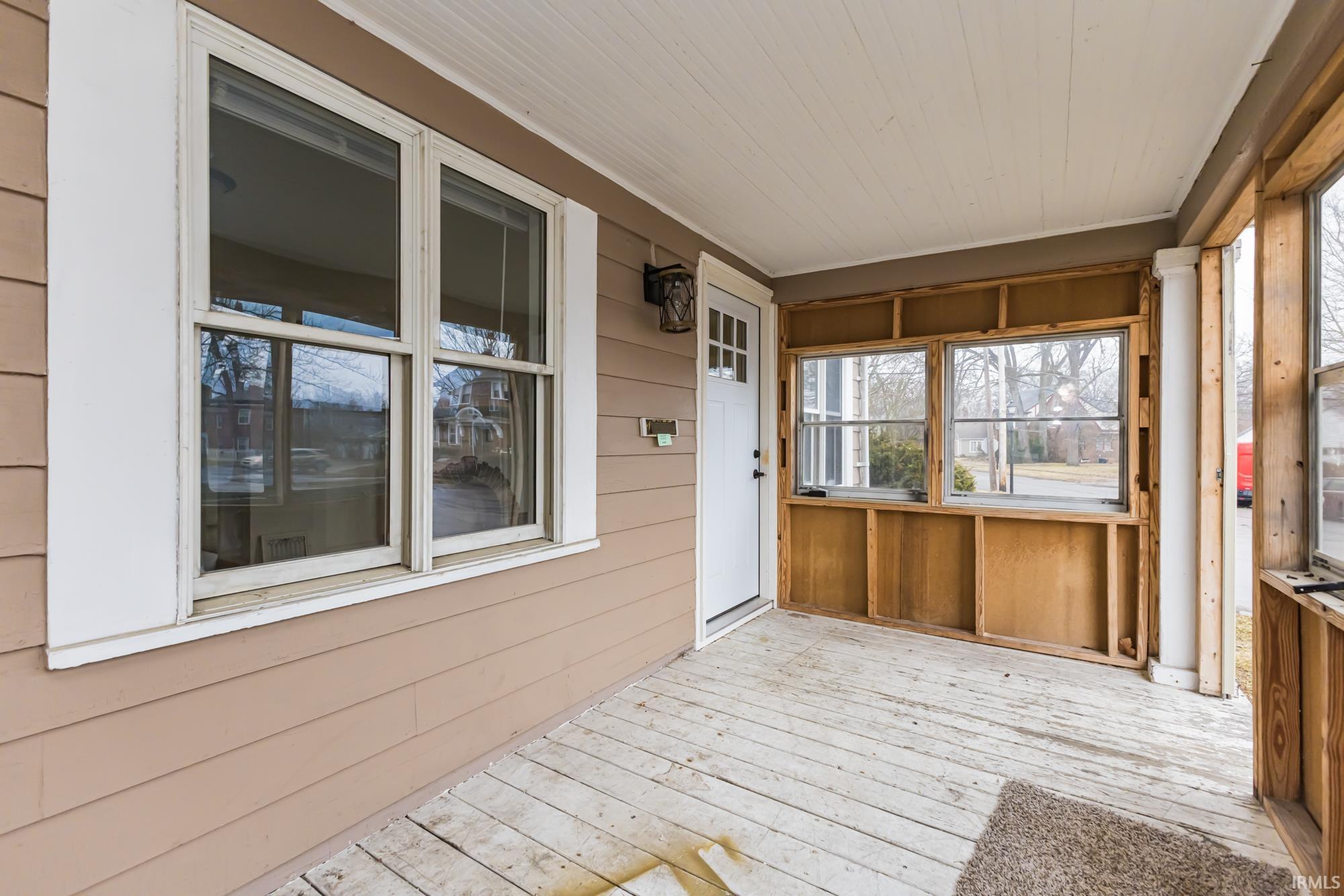 Wooden deck with a sunroom