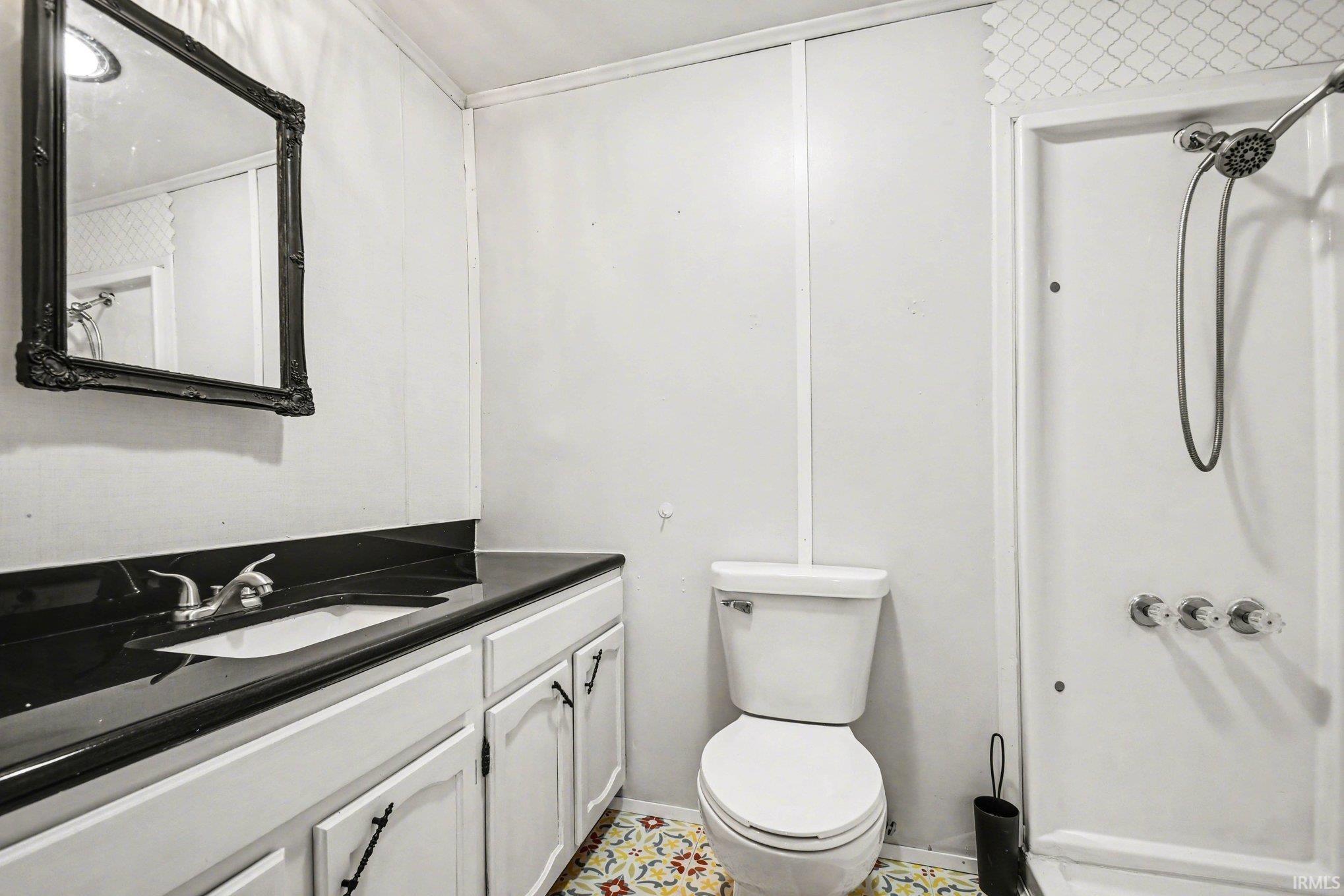 Full bath with vanity and toilet