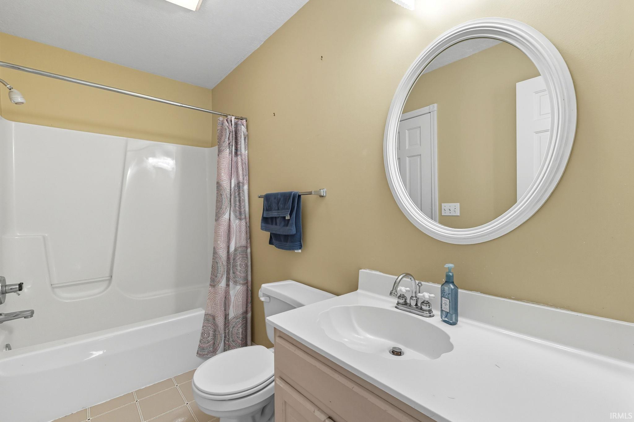 Bathroom with vanity and shower / bath combo