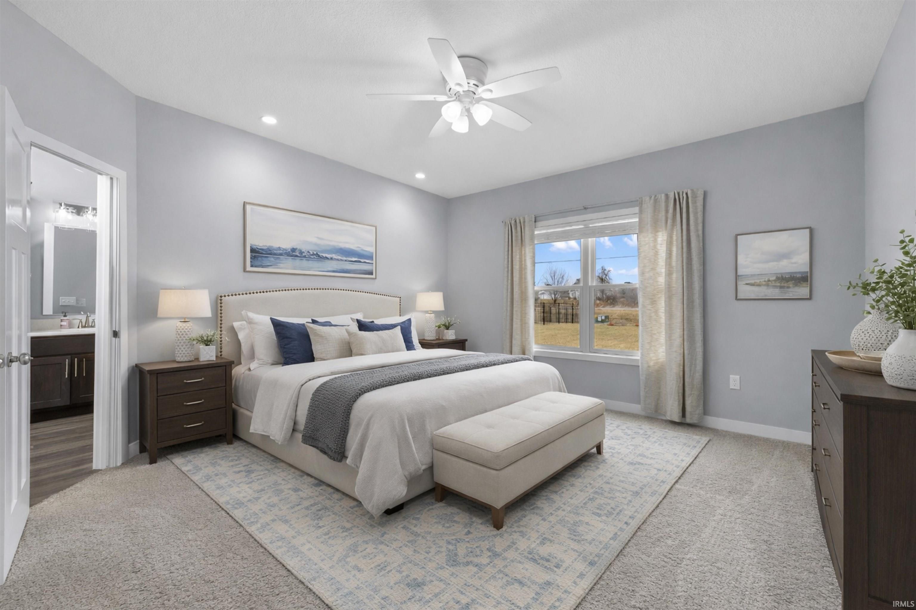 Virtually Staged Master Bedroom with light carpet, ceiling fan, recessed lighting, and connected bathroom
