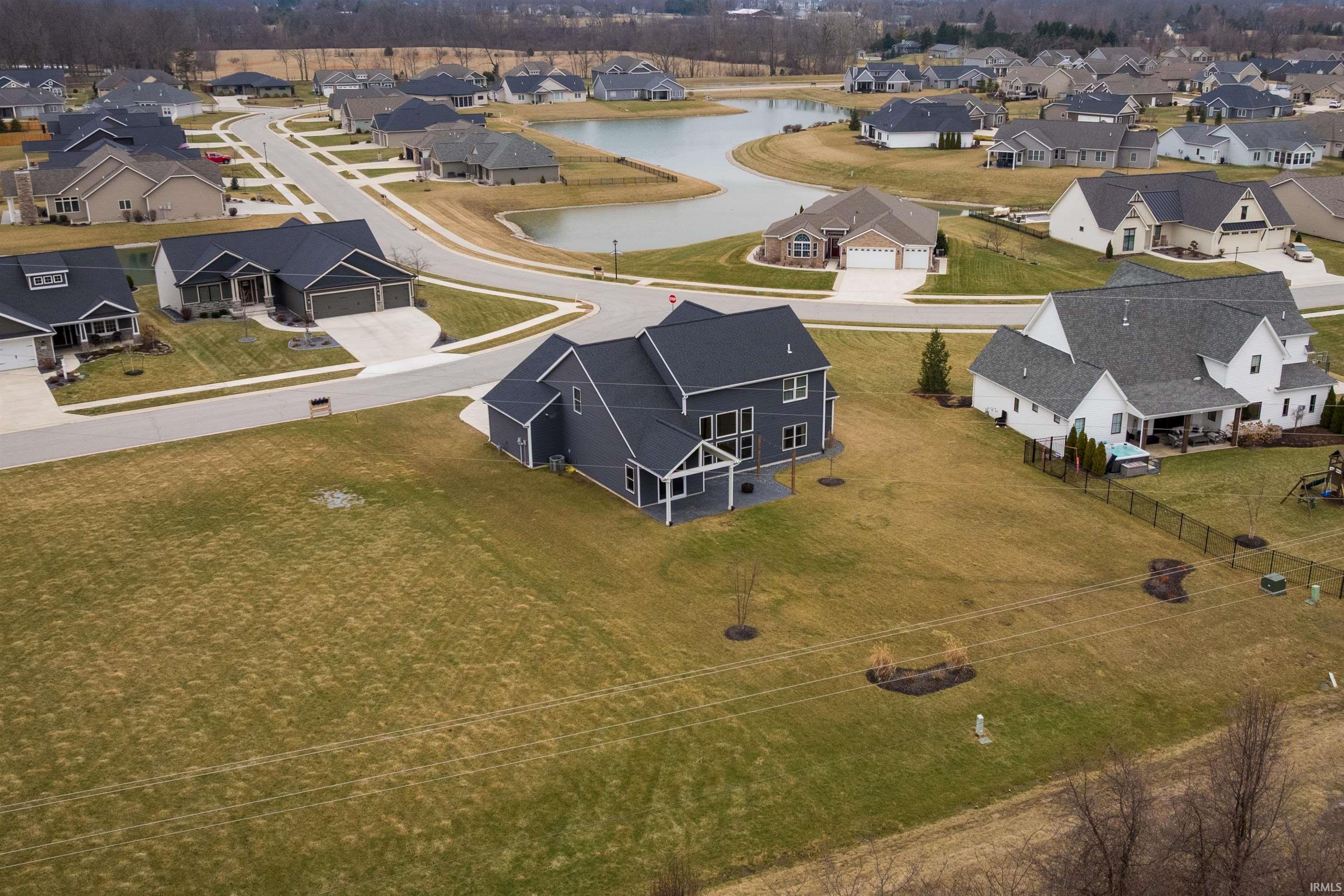 Aerial view of residential area with a large body of water