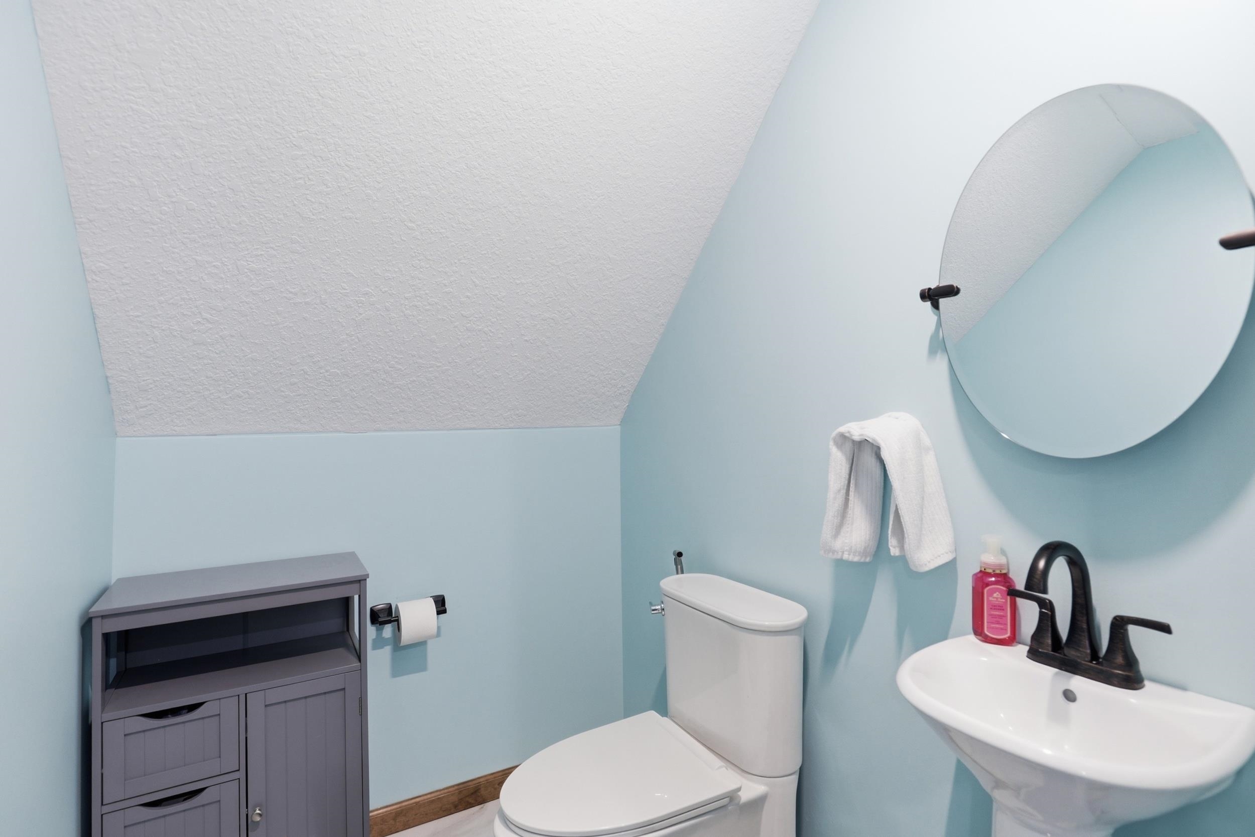 Bathroom featuring toilet and a sink