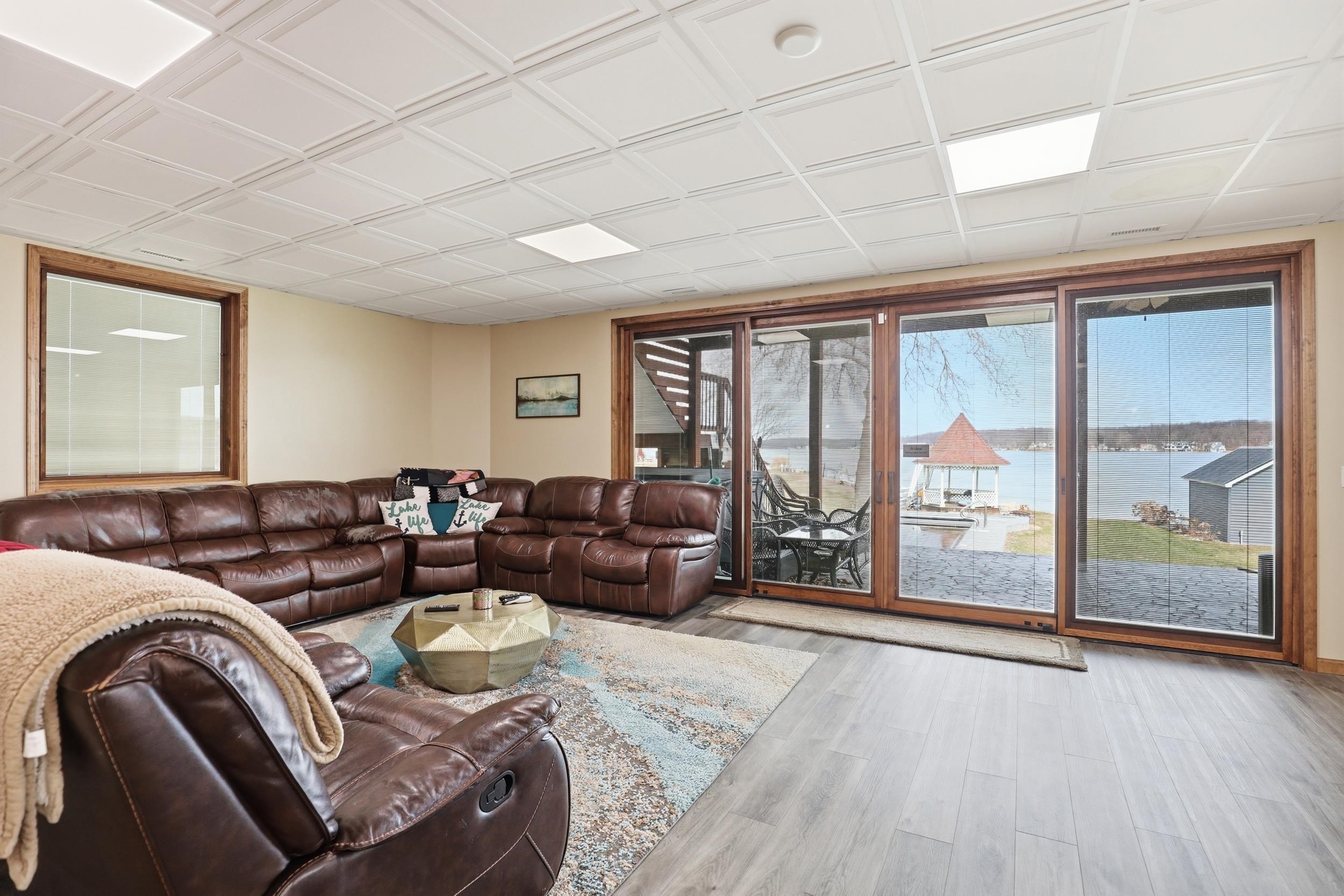 Living room featuring light wood finished floors and an ornate ceiling