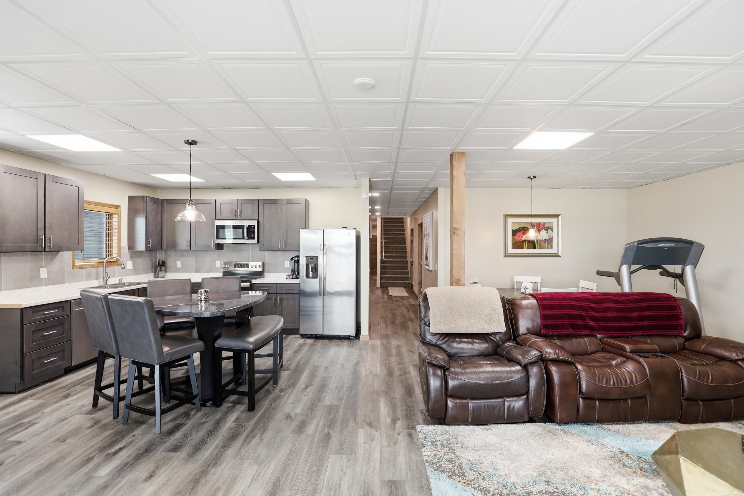Living area with stairway and light wood finished floors