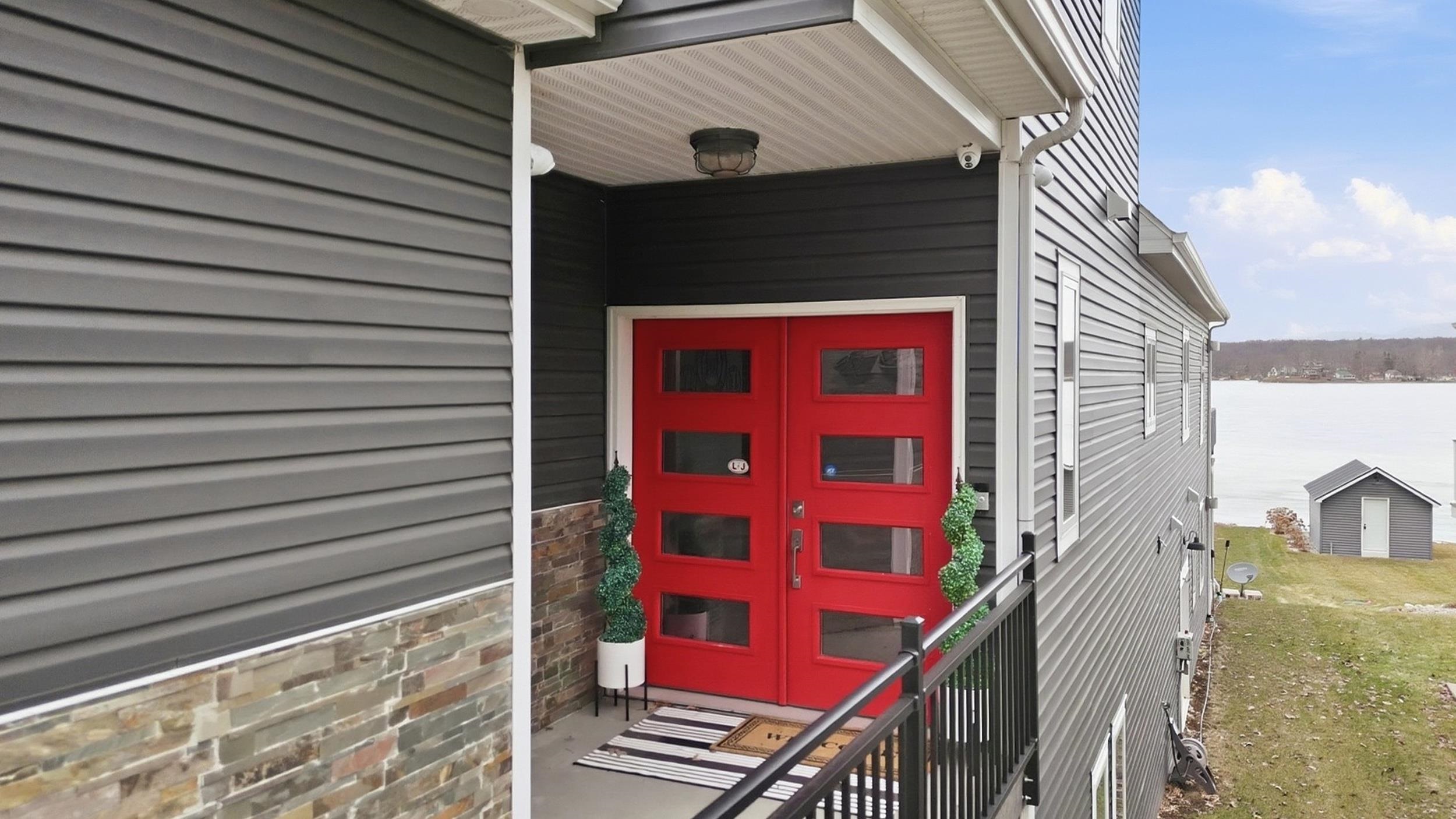 Property entrance with stone siding