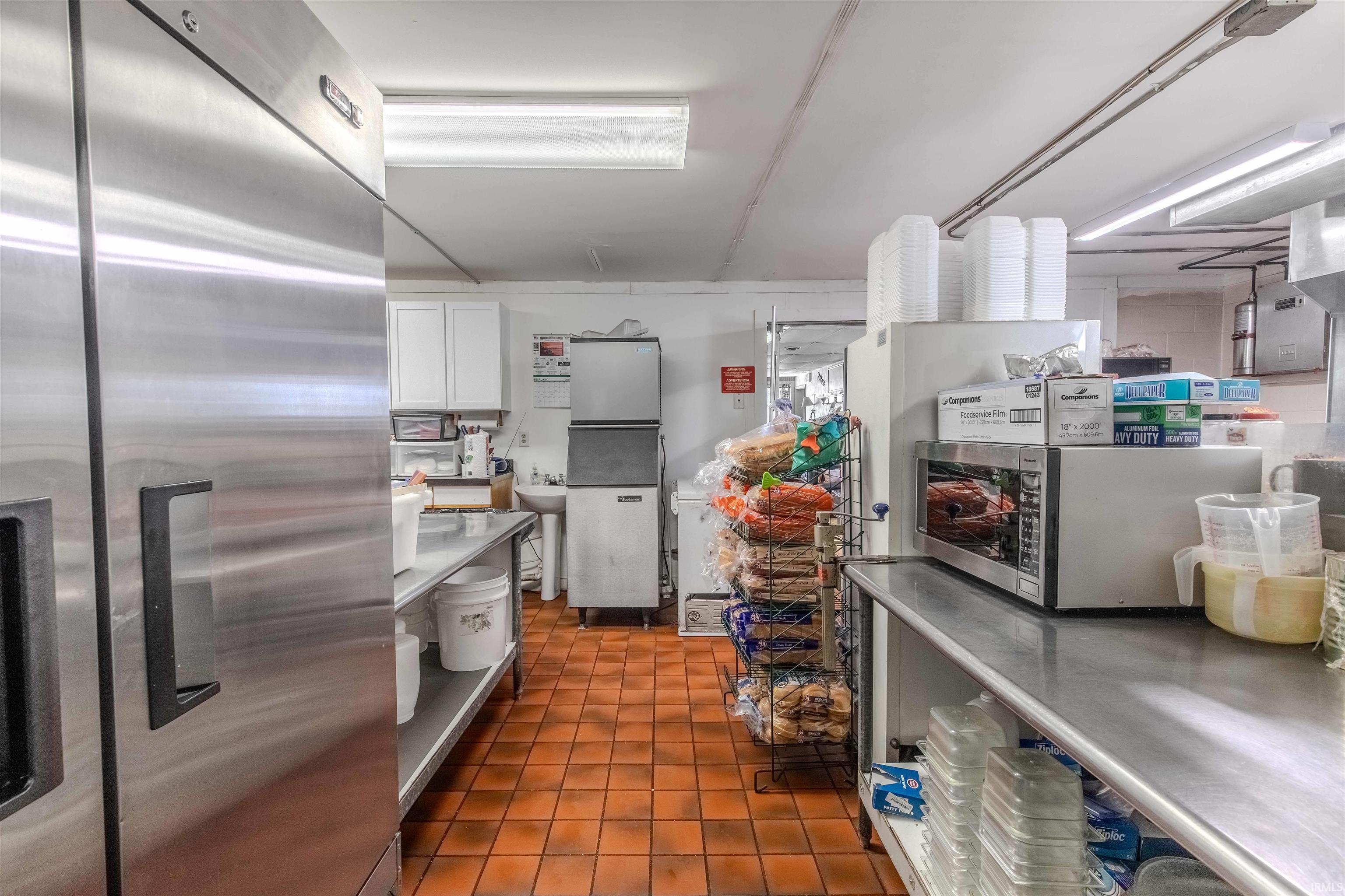 Kitchen with stainless steel appliances and white cabinets