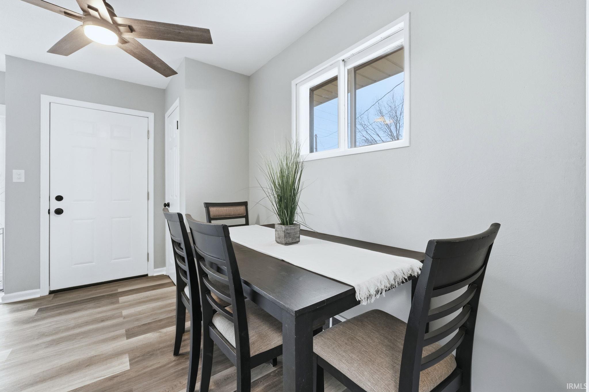 Dining room featuring light wood-style floors and a ceiling fan