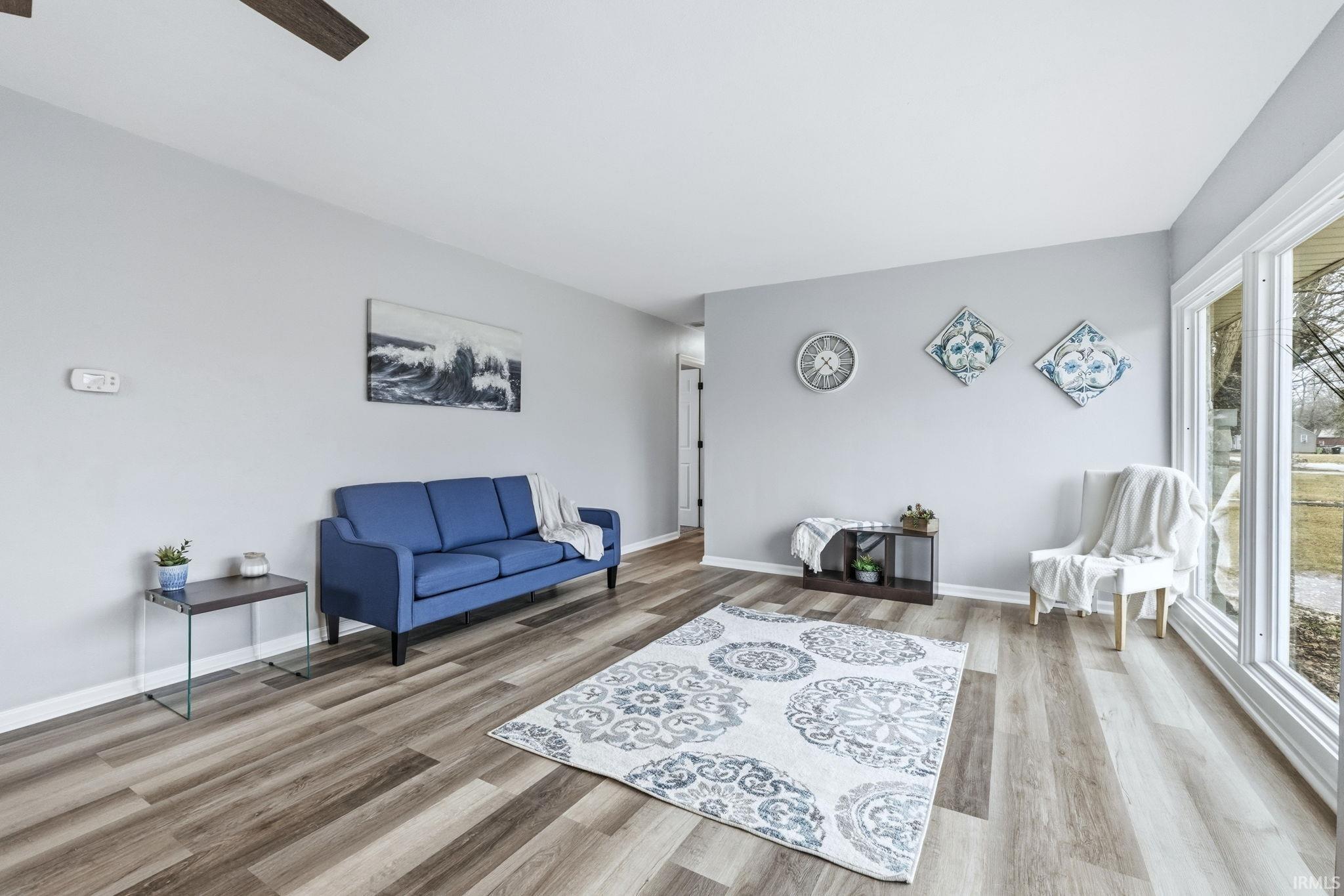 Sitting room featuring light wood-style flooring