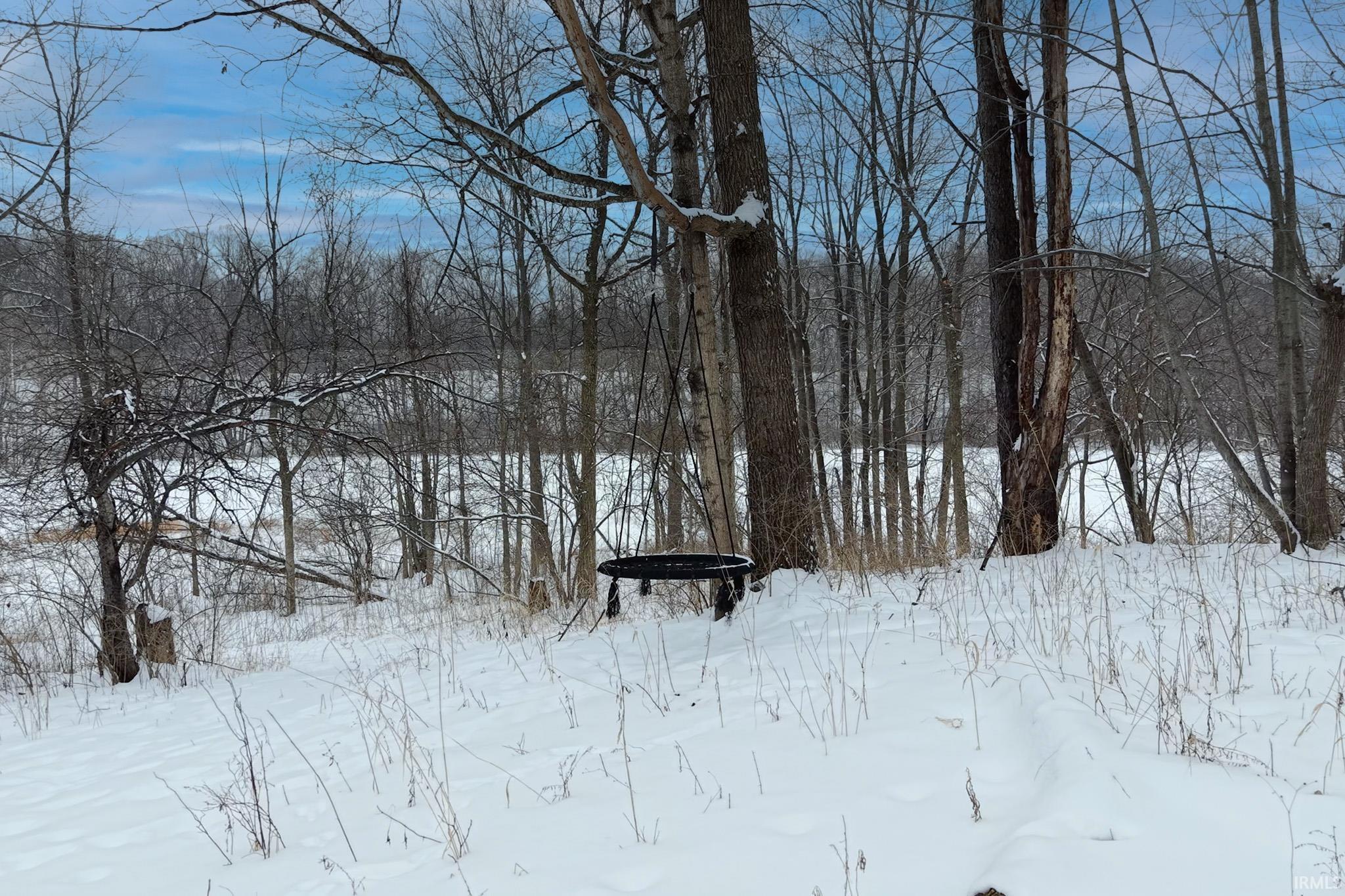 View of yard layered in snow