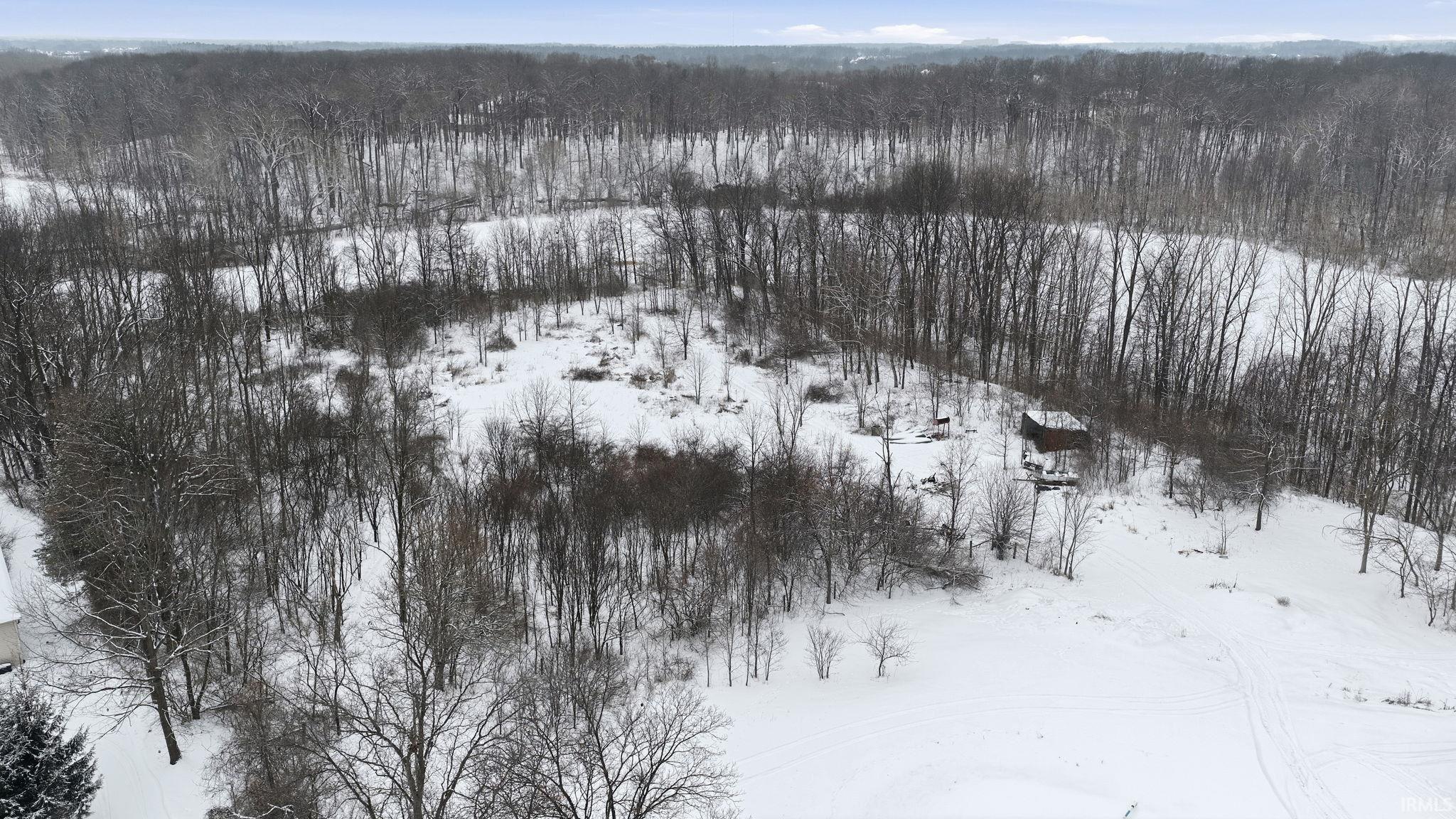 Drone / aerial view of a heavily wooded area