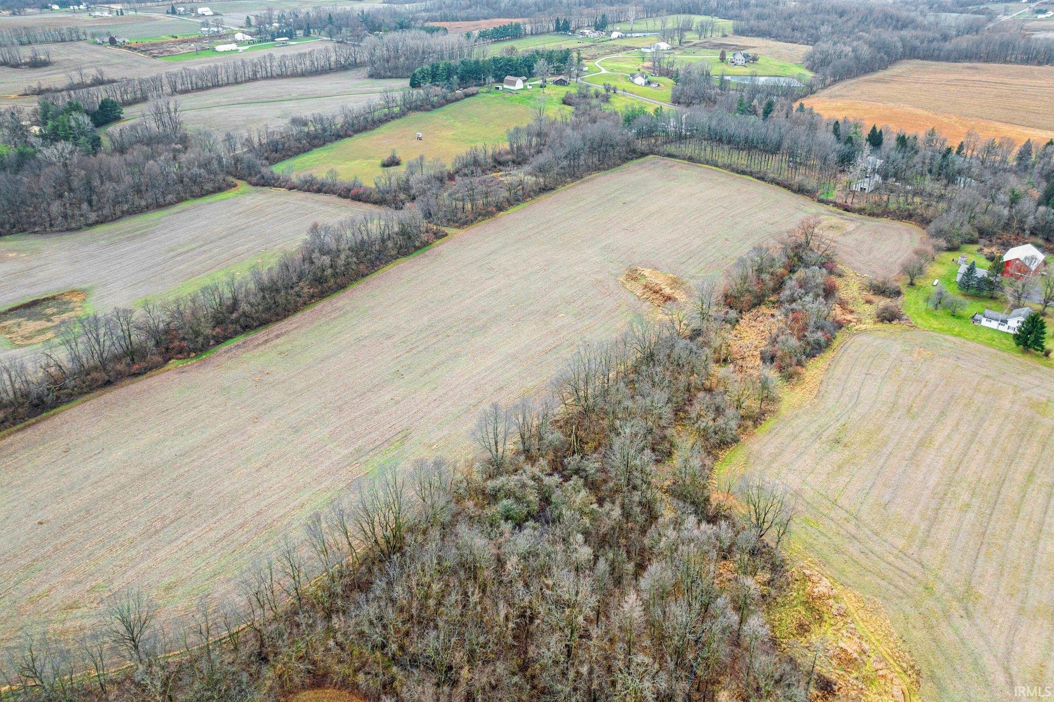 Aerial view of sparsely populated area with extensive farmland