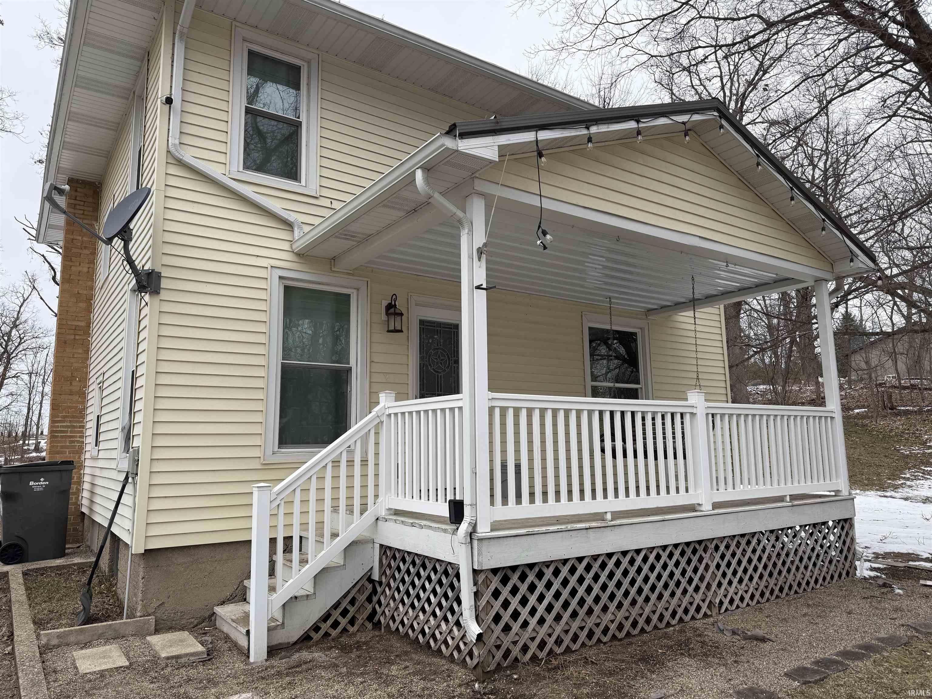 Rear view of property with a porch