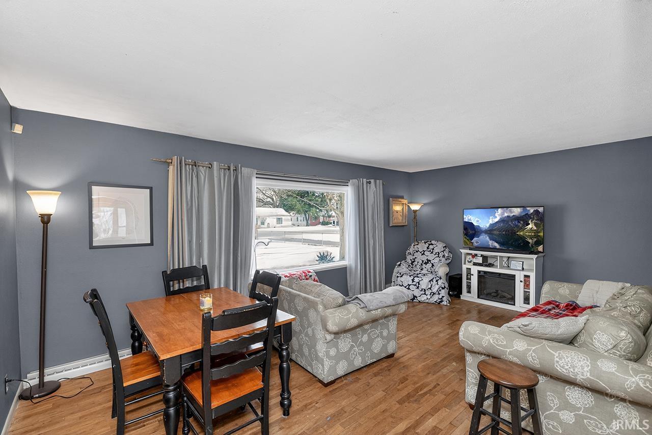 Living room with wood finished floors and baseboards