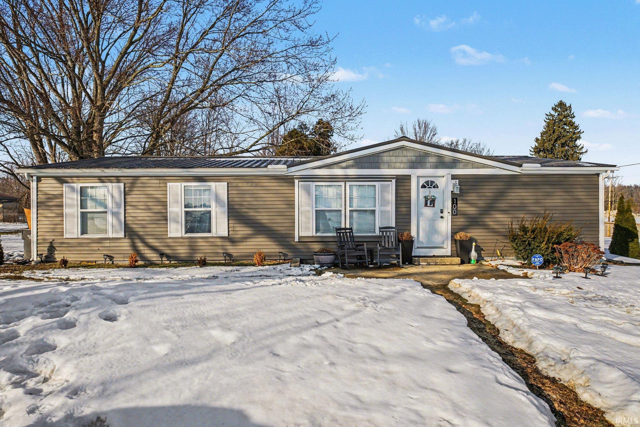 View of front of home featuring a metal roof