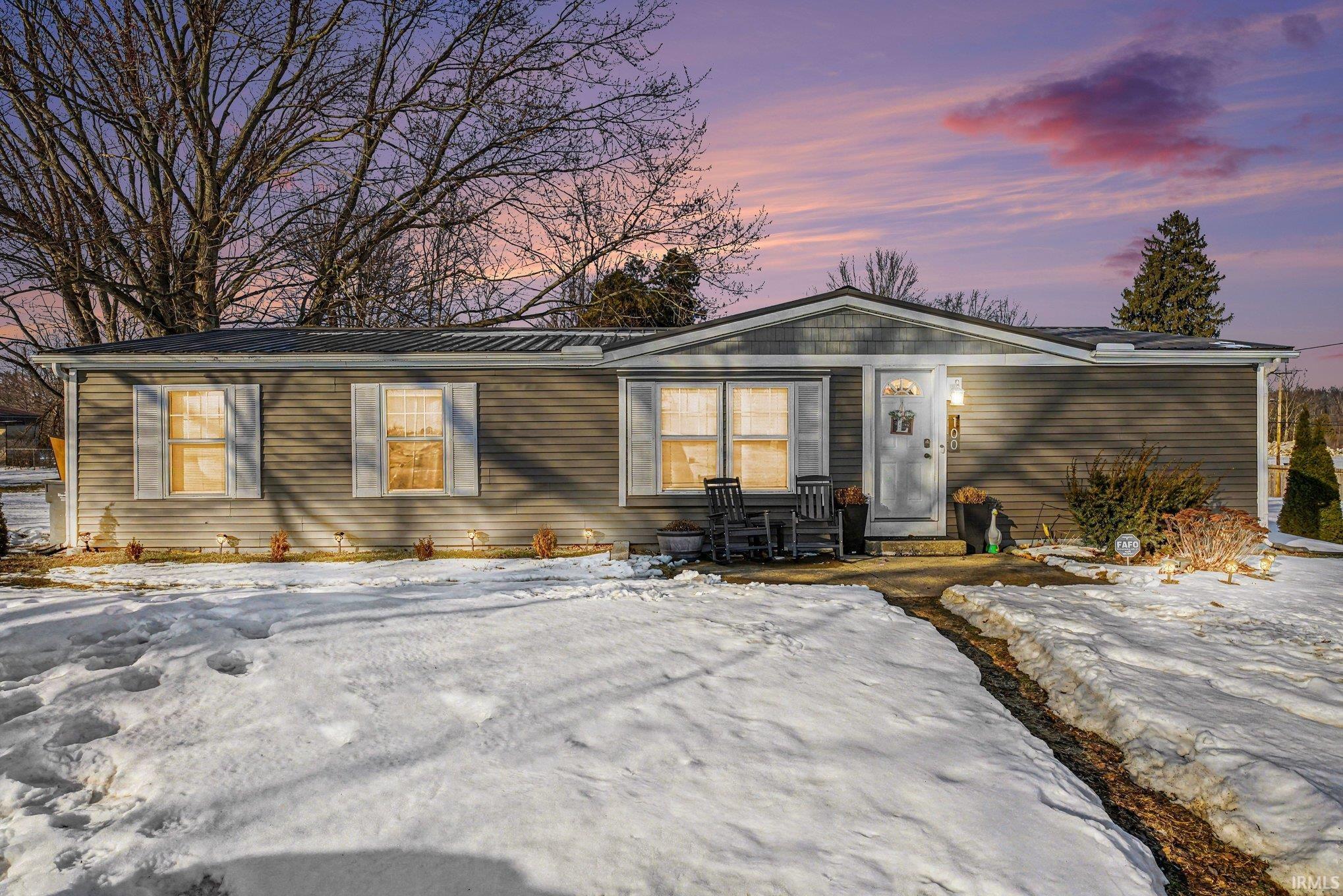 View of front of home with a metal roof