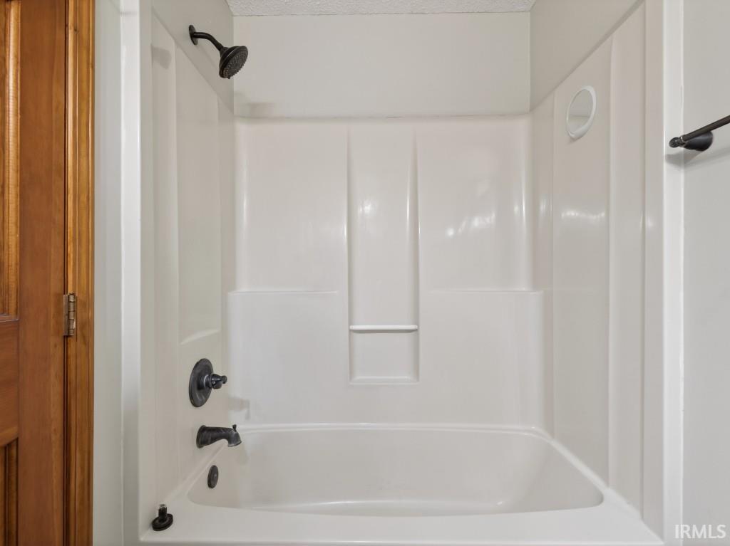 Full bathroom with shower / bath combination